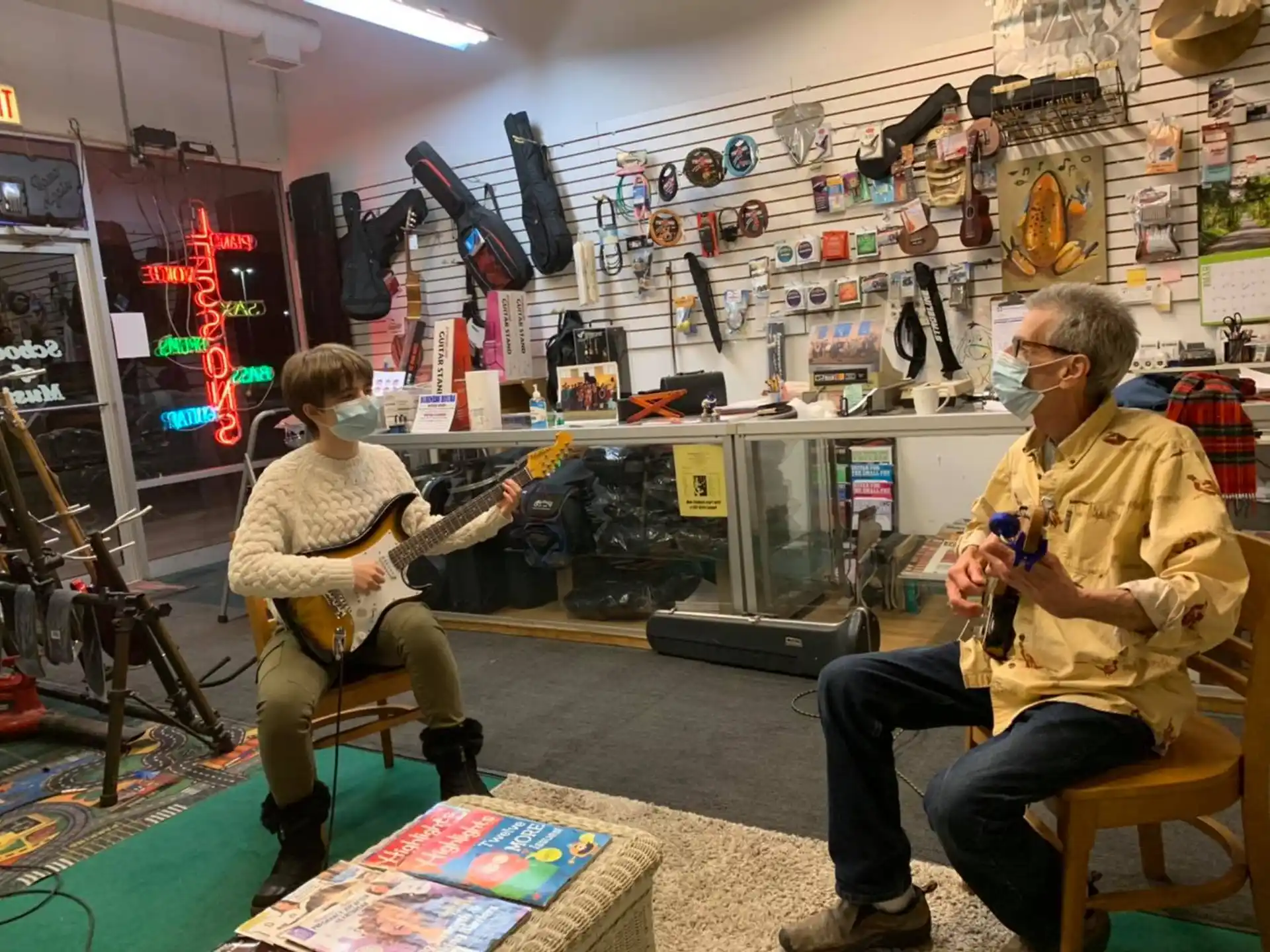 a couple of men playing guitars