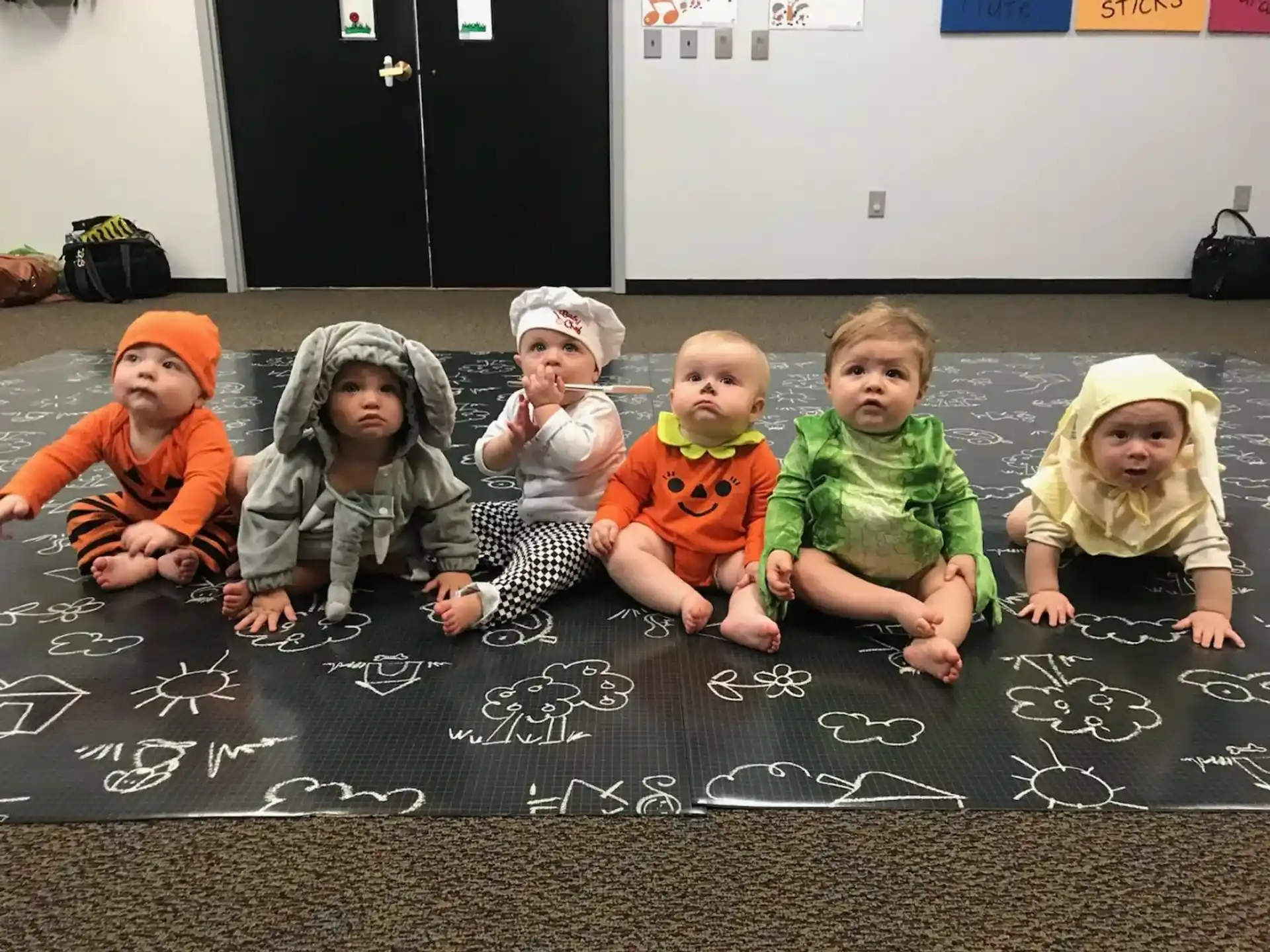 a group of children sitting on the floor