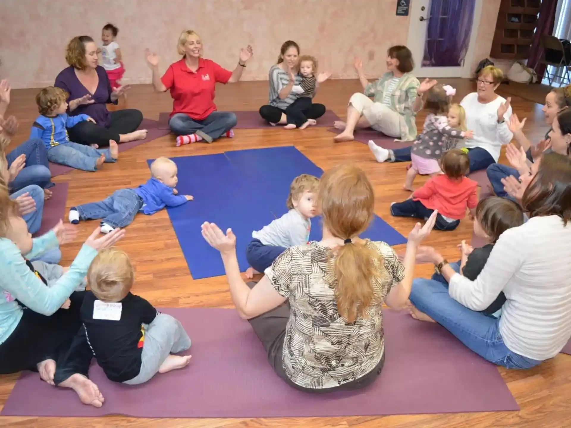 a group of people sitting on the floor
