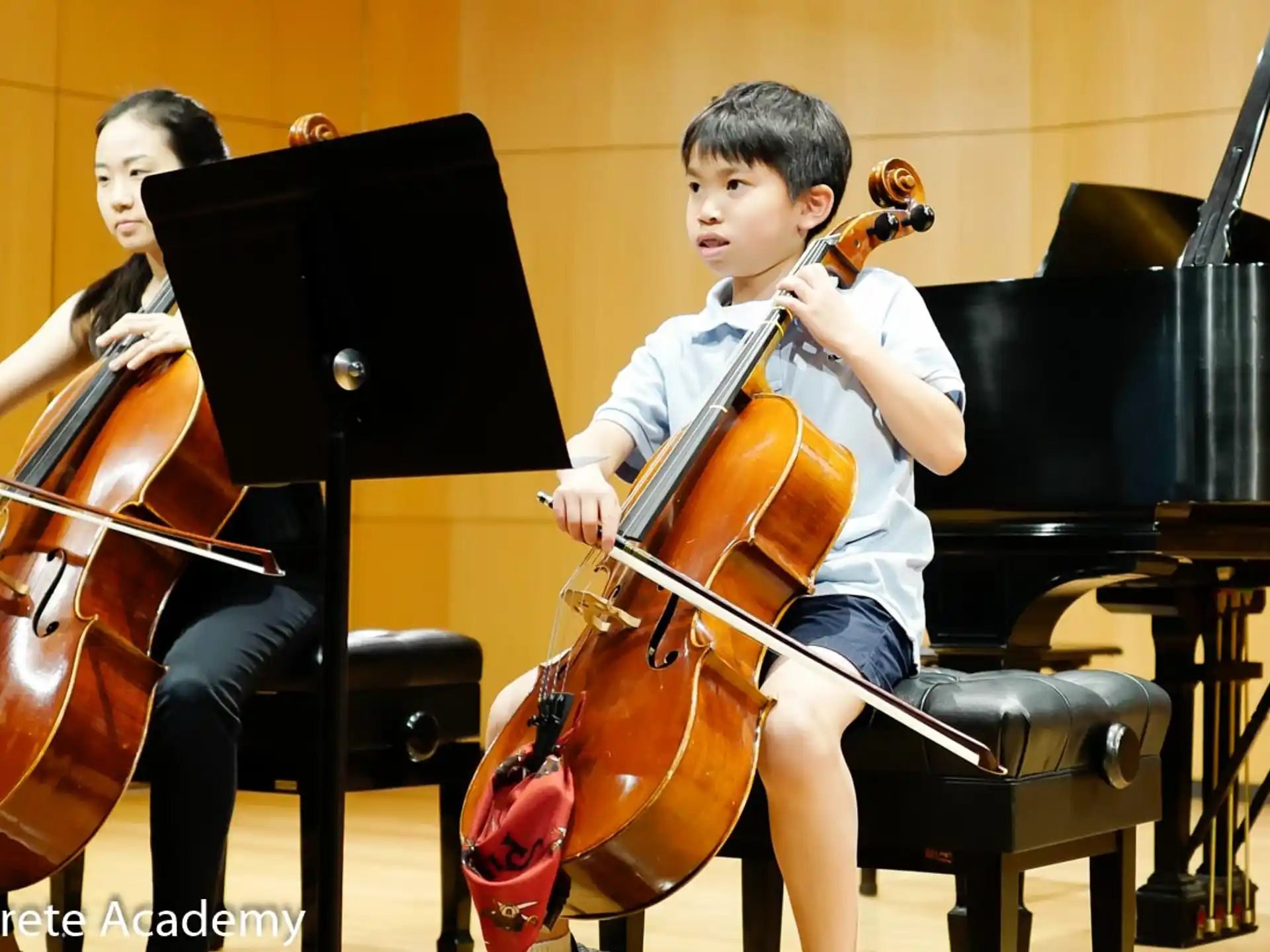 a boy playing a cello