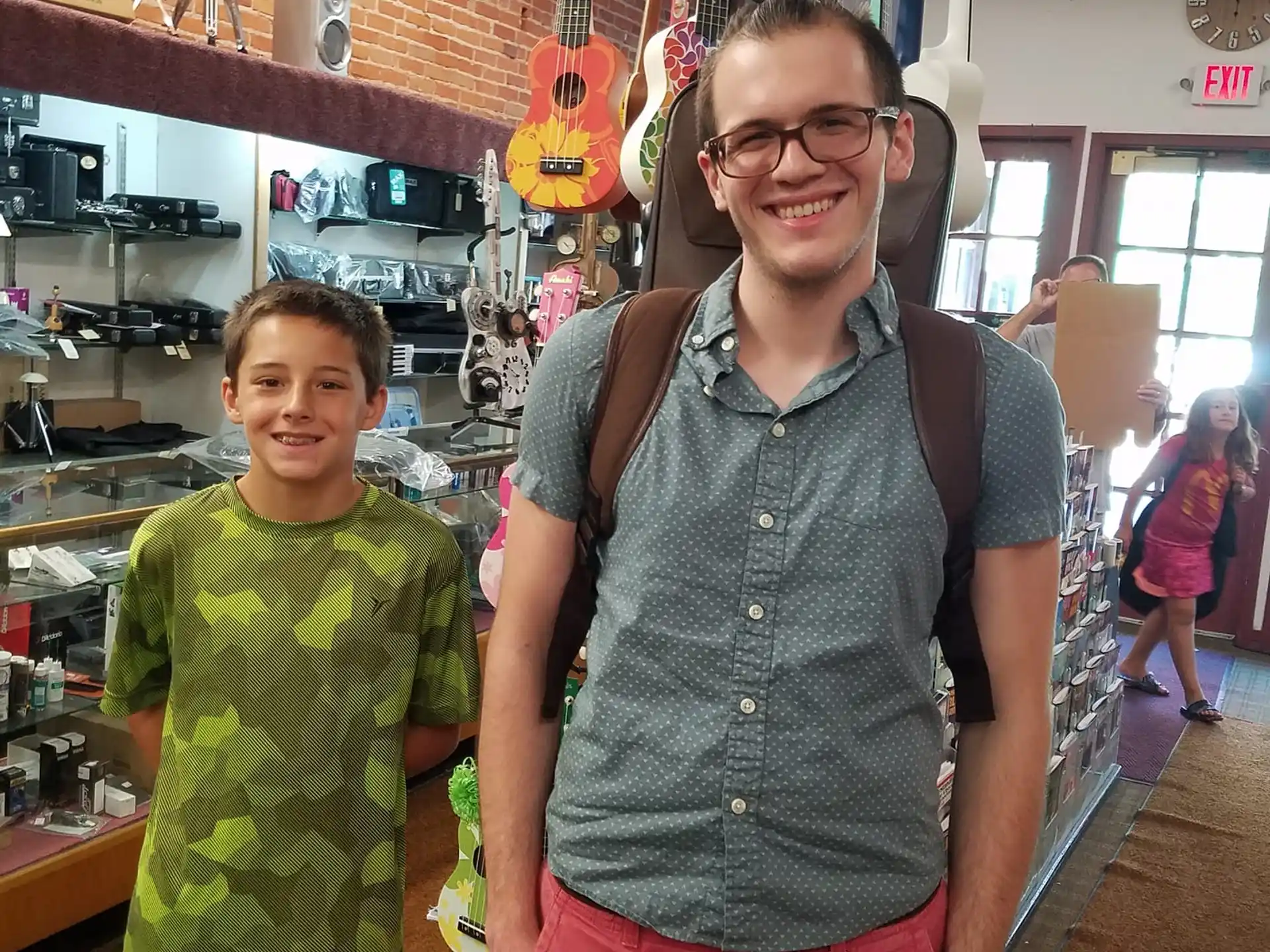 a person and a boy posing for a picture