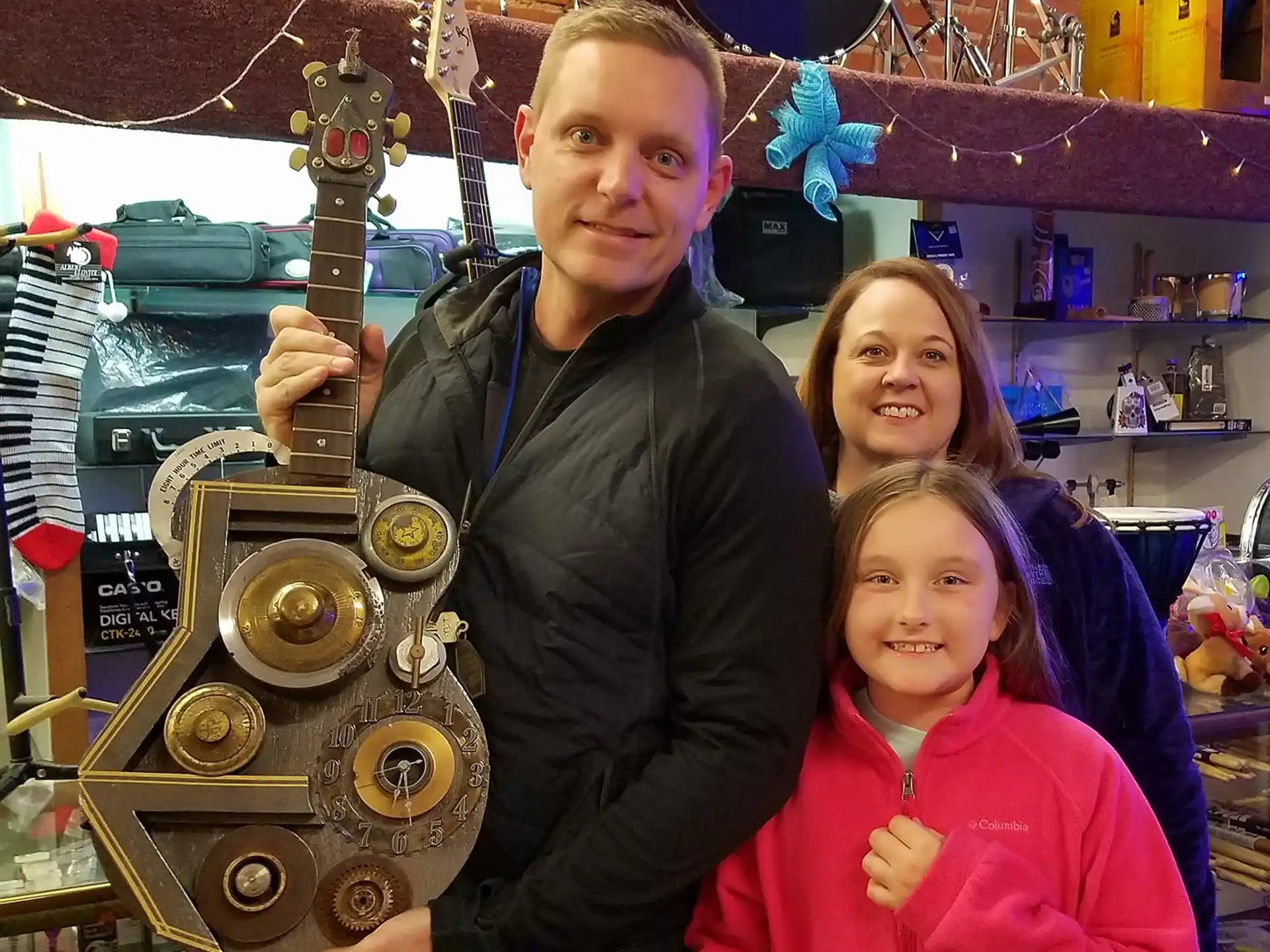 a person and two girls posing for a picture