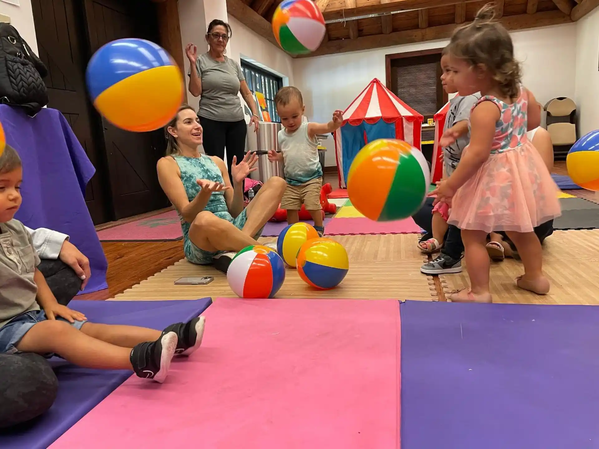 a group of children playing with balloons