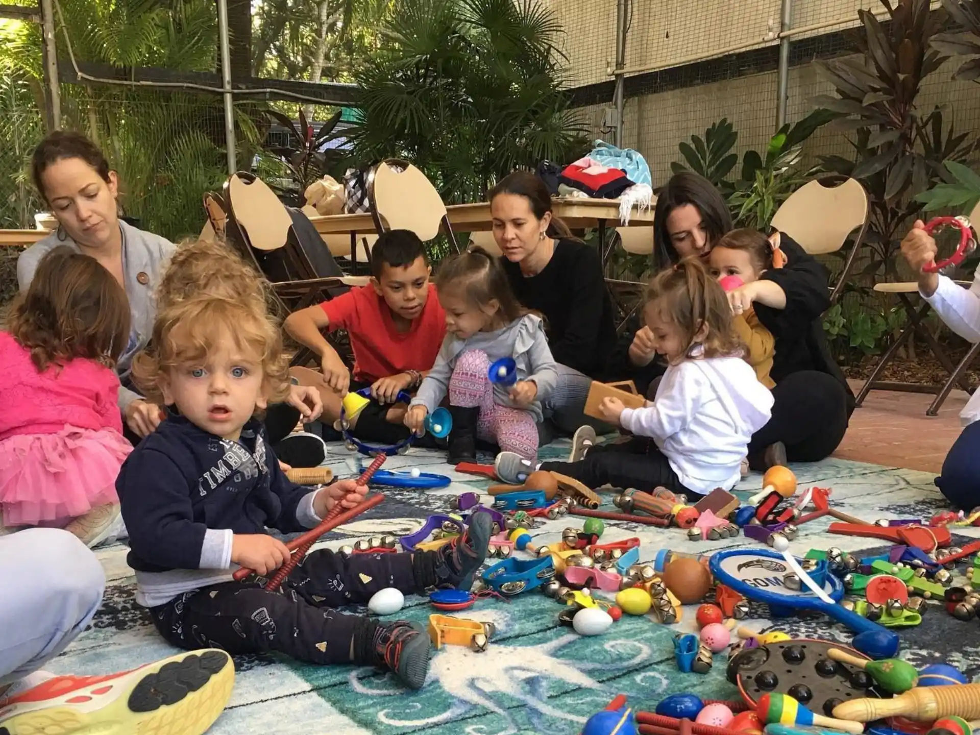 a group of children sitting on the ground