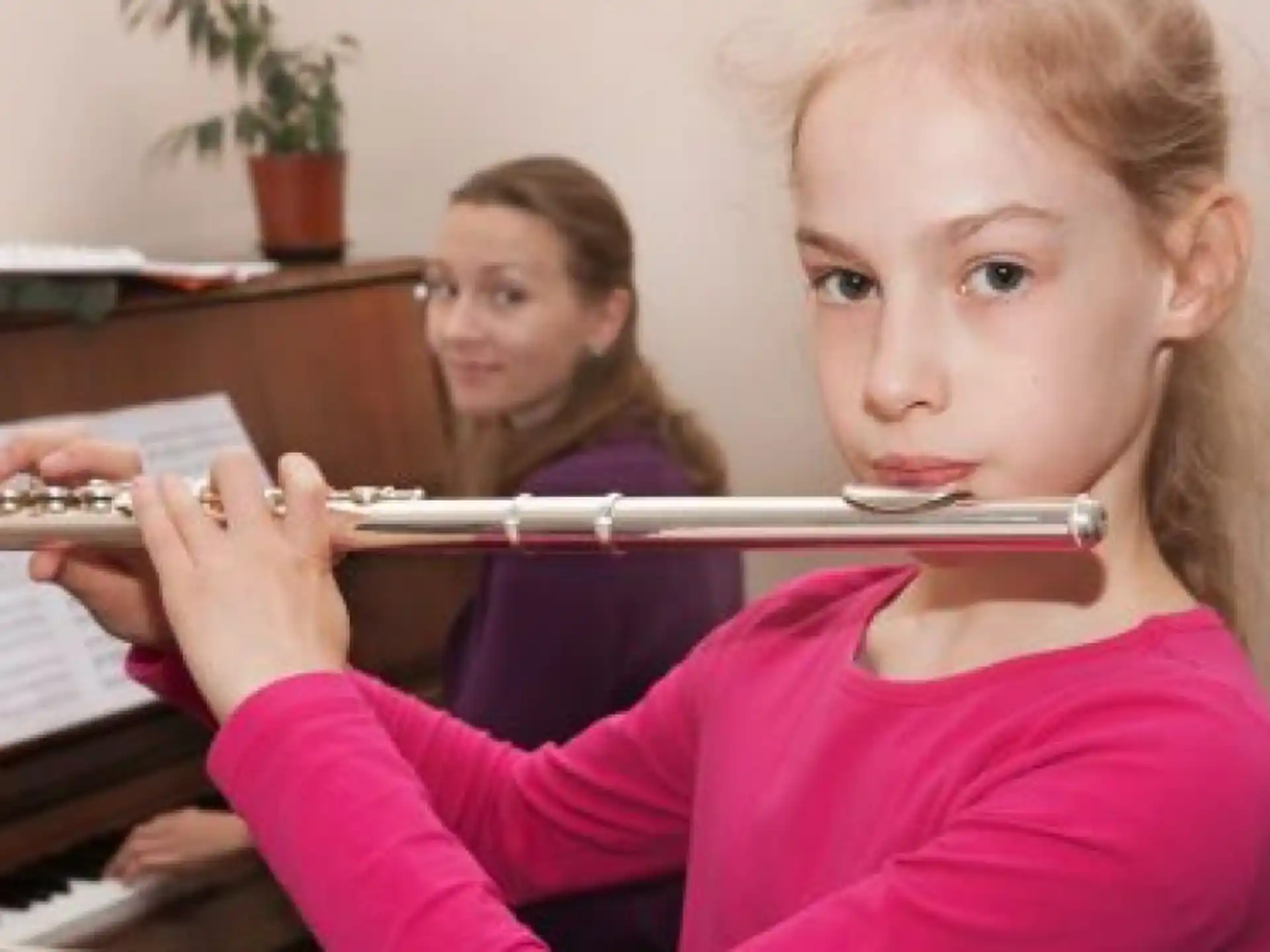 a girl playing a flute