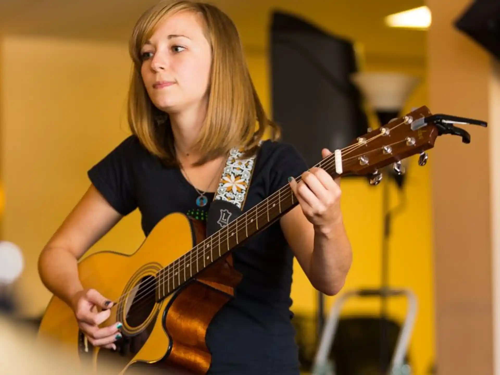 a person playing a guitar