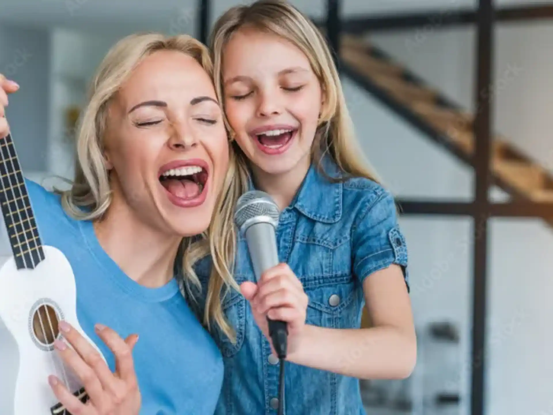 a couple of girls singing into microphones