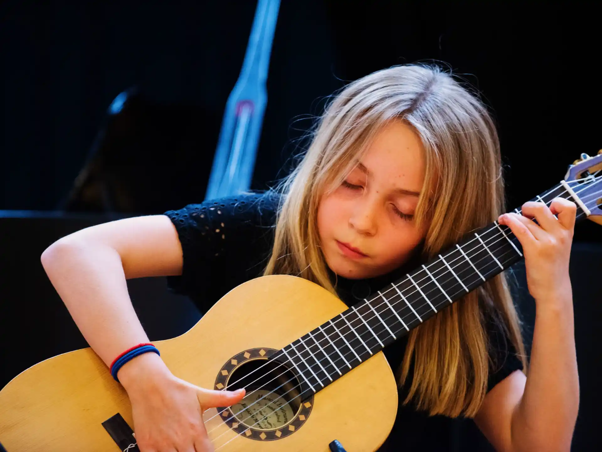 a woman playing a guitar