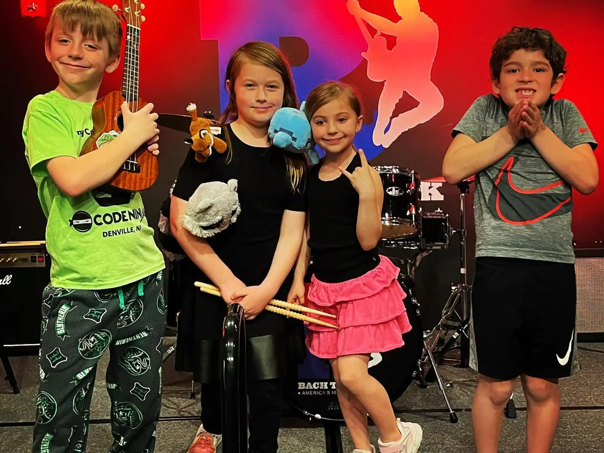 a group of kids posing for a photo