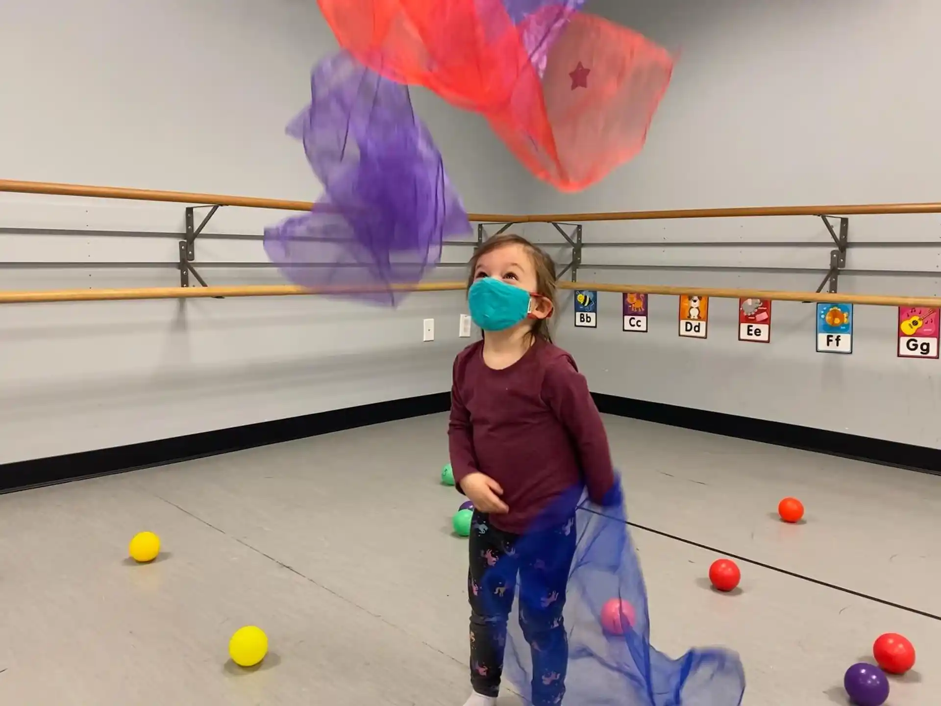a girl playing a game of bowling