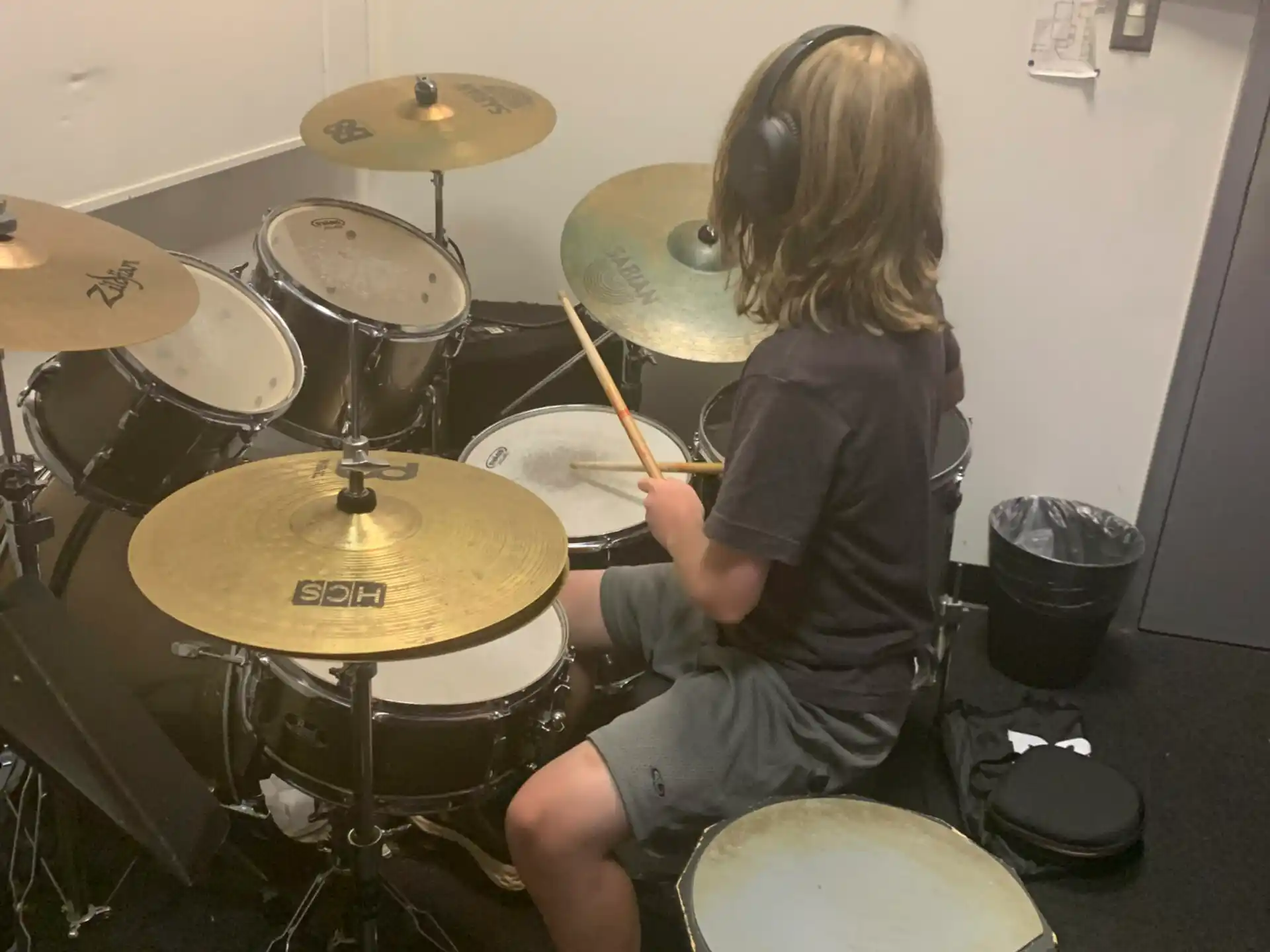 a person playing a drum set