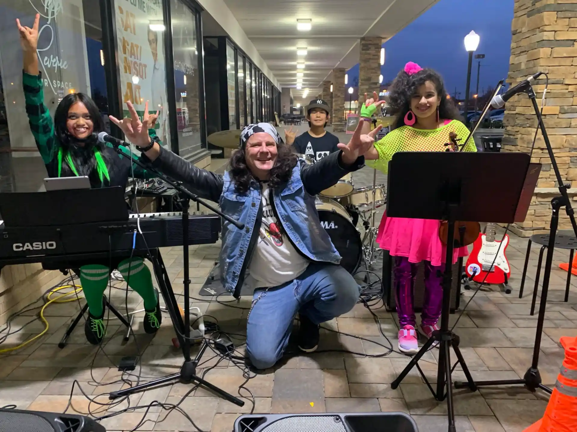a group of people holding musical instruments