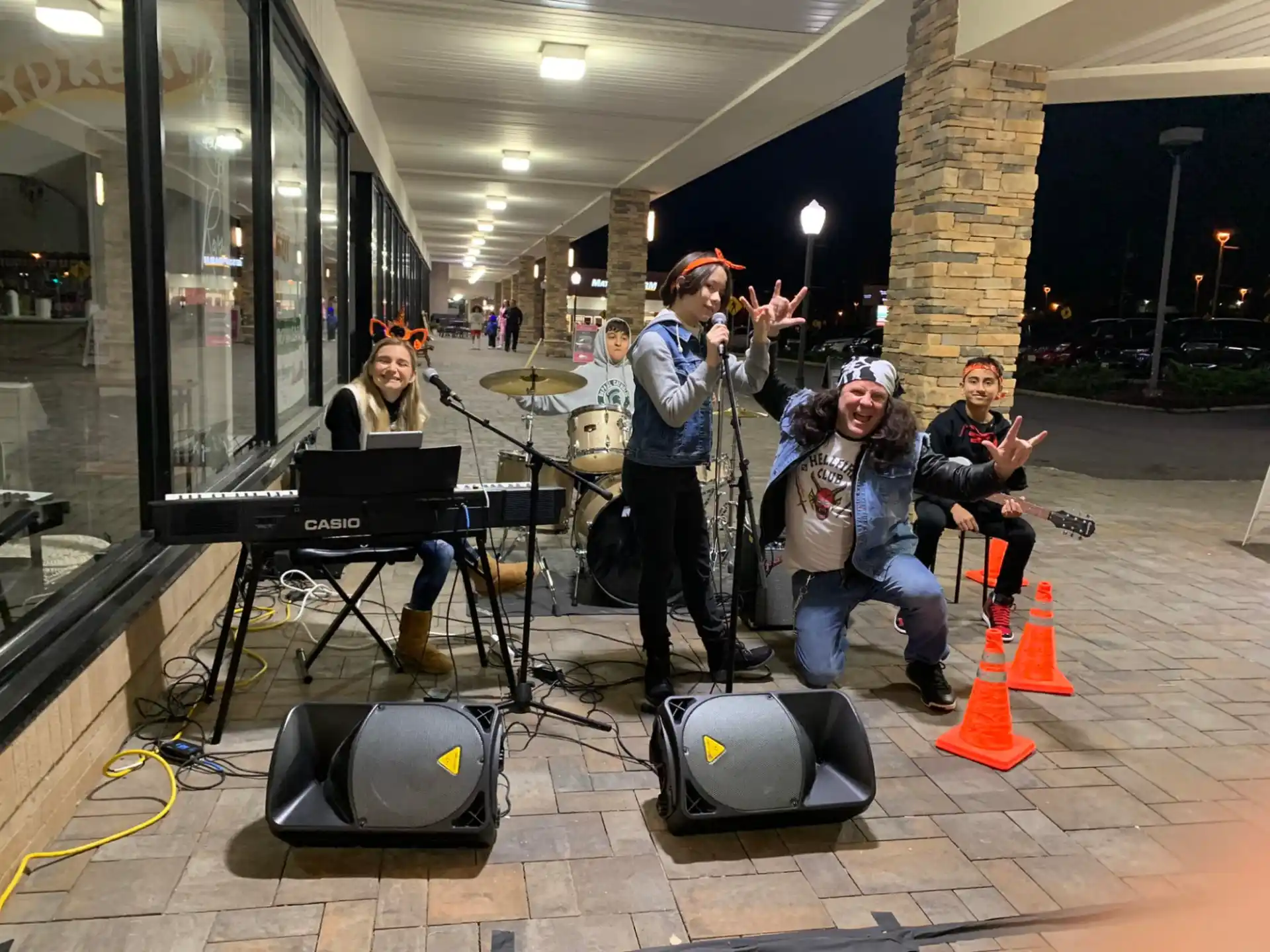 a group of people sitting at a table with musical instruments