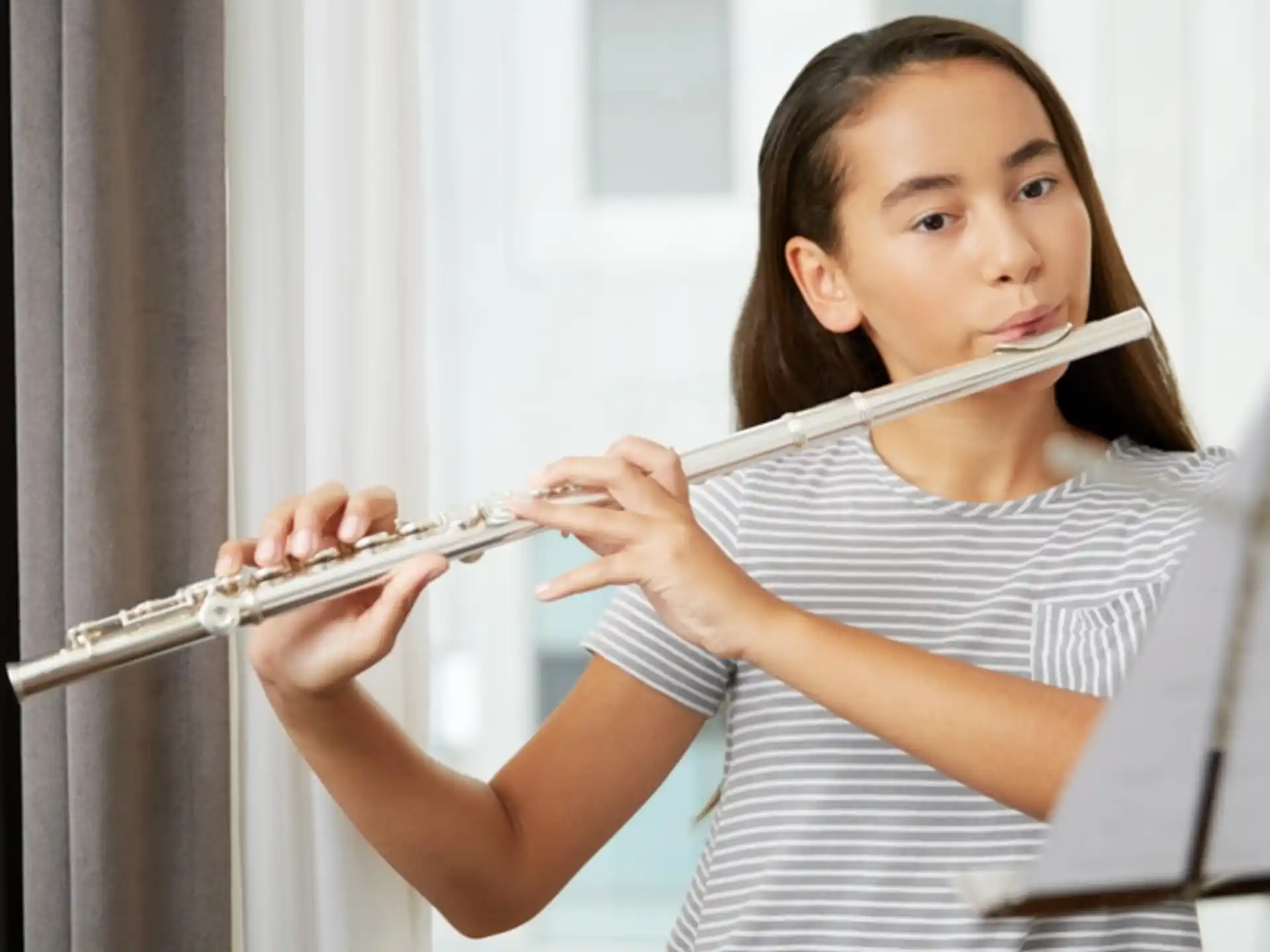 a girl playing a flute
