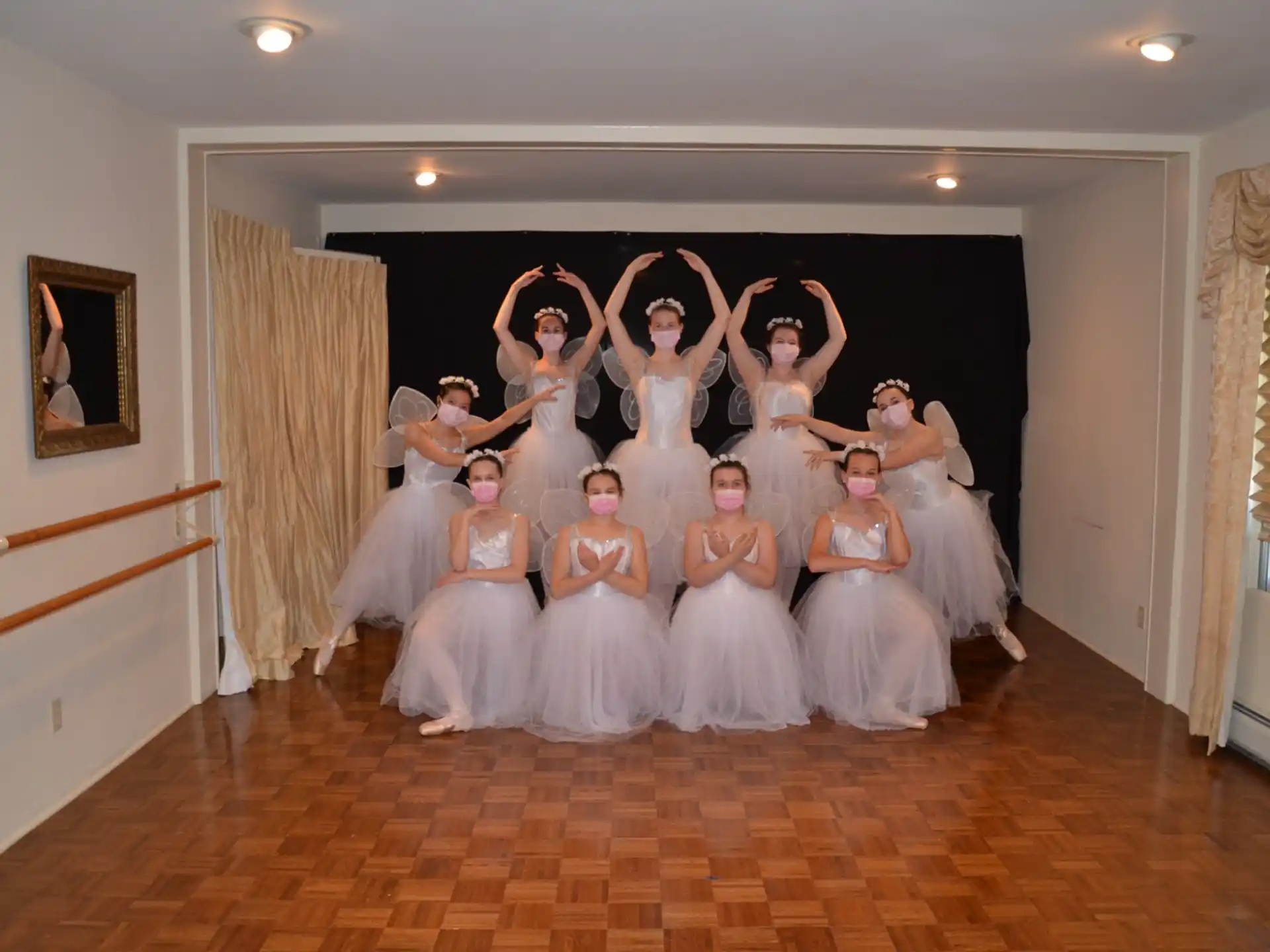 a group of women in white dresses