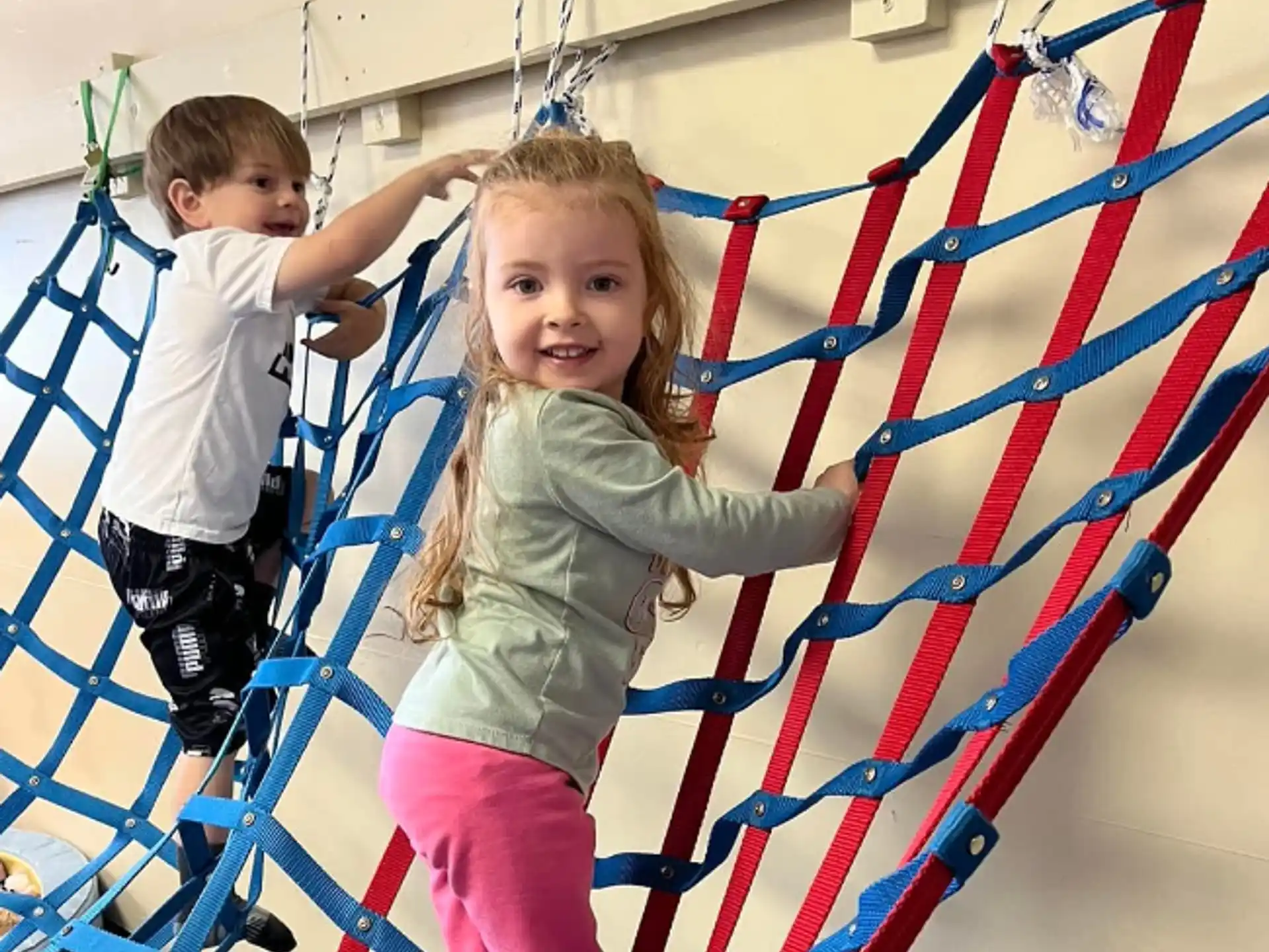 a couple of children playing on a playground