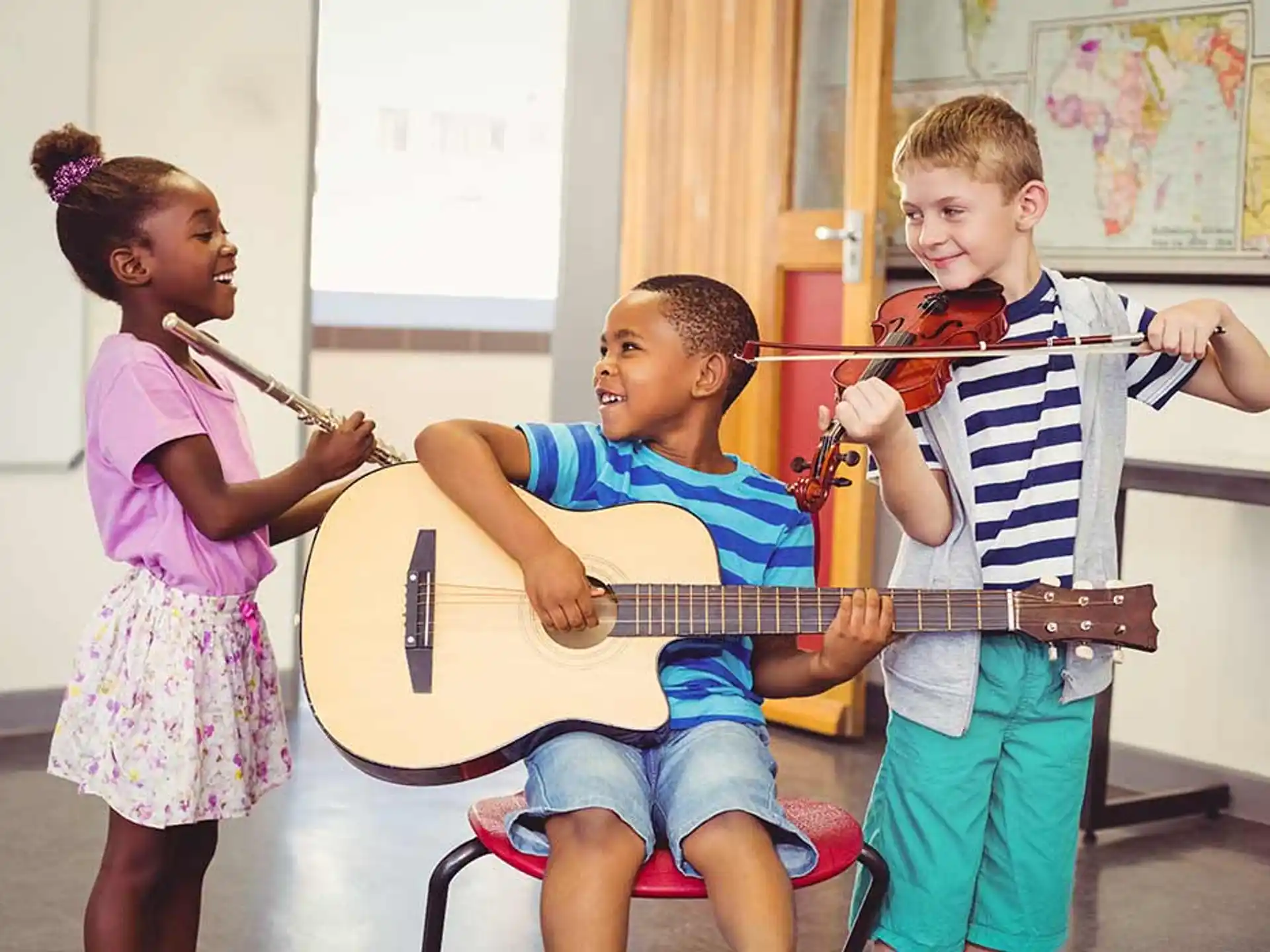 a group of children playing a musical instrument