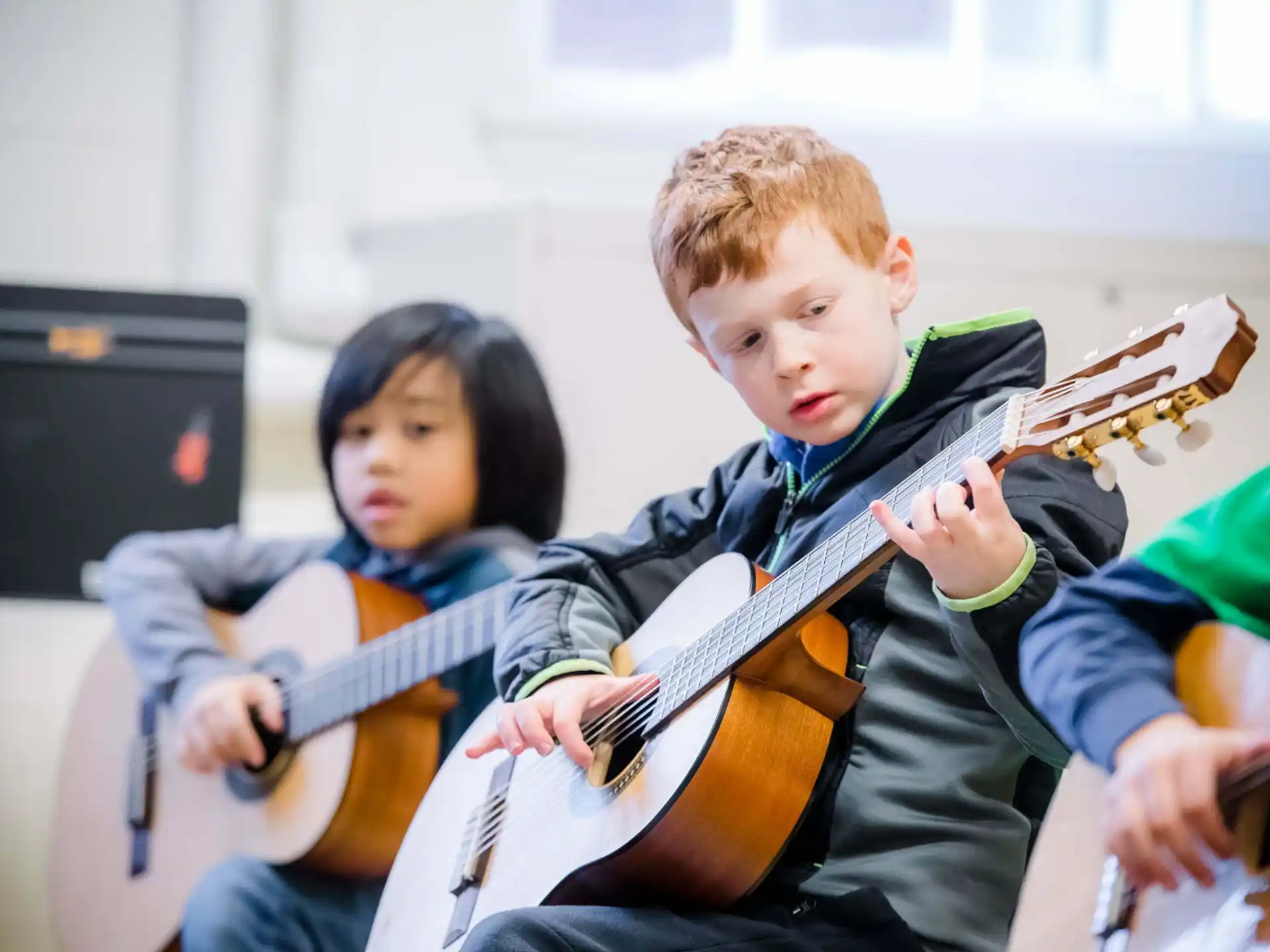 a group of kids playing instruments
