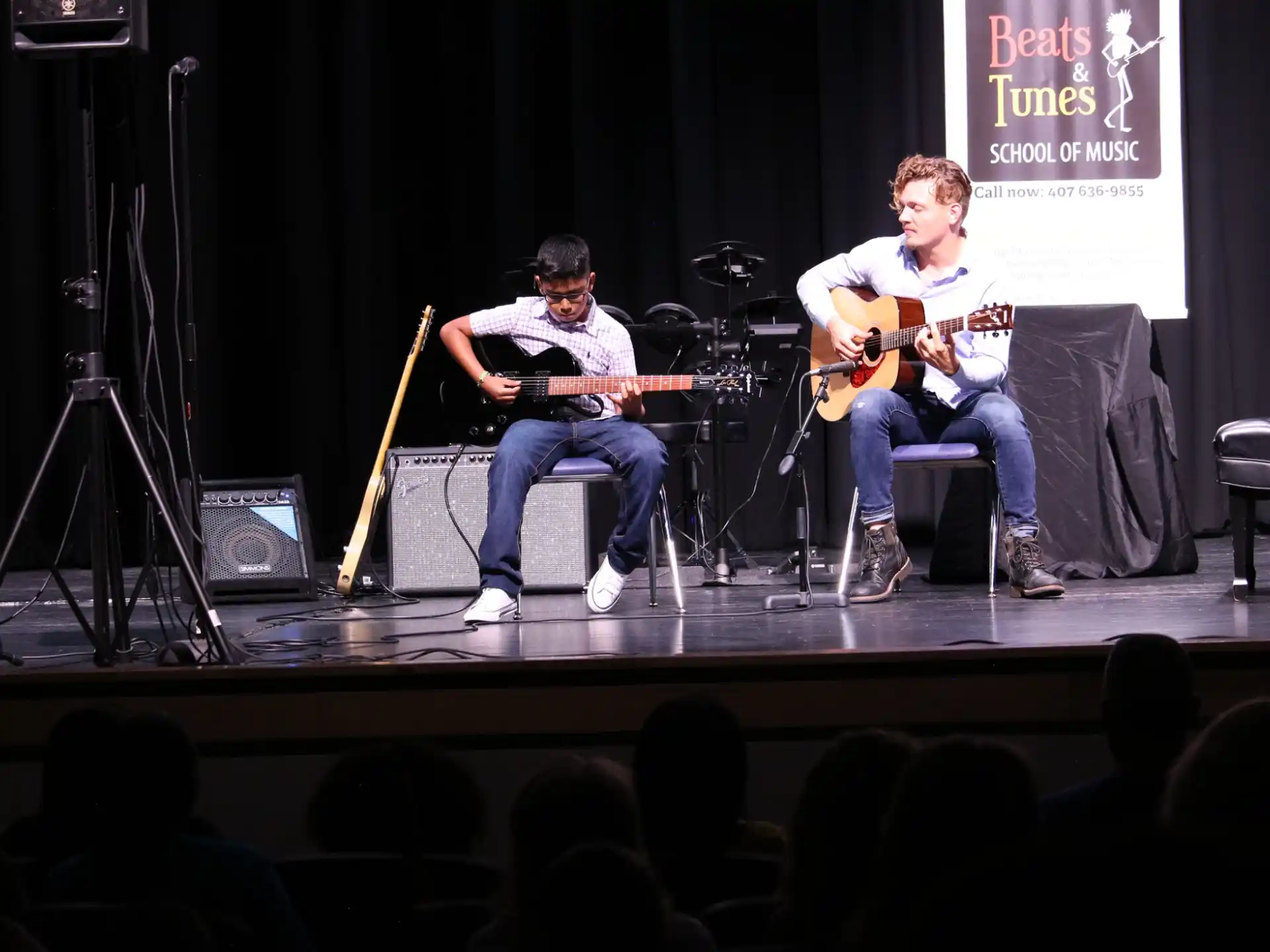 a group of men playing instruments on a stage