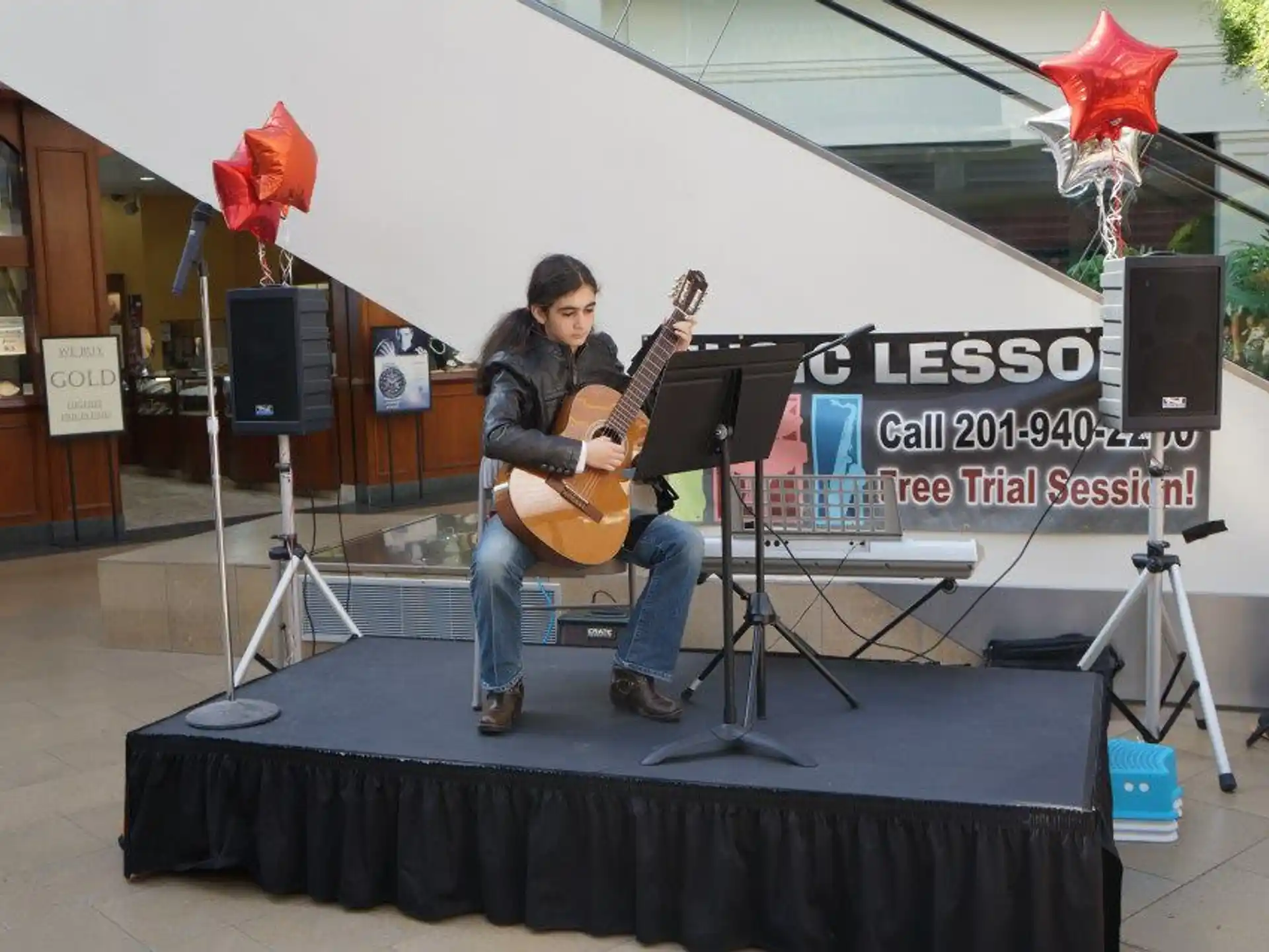 a person playing a guitar on a stage