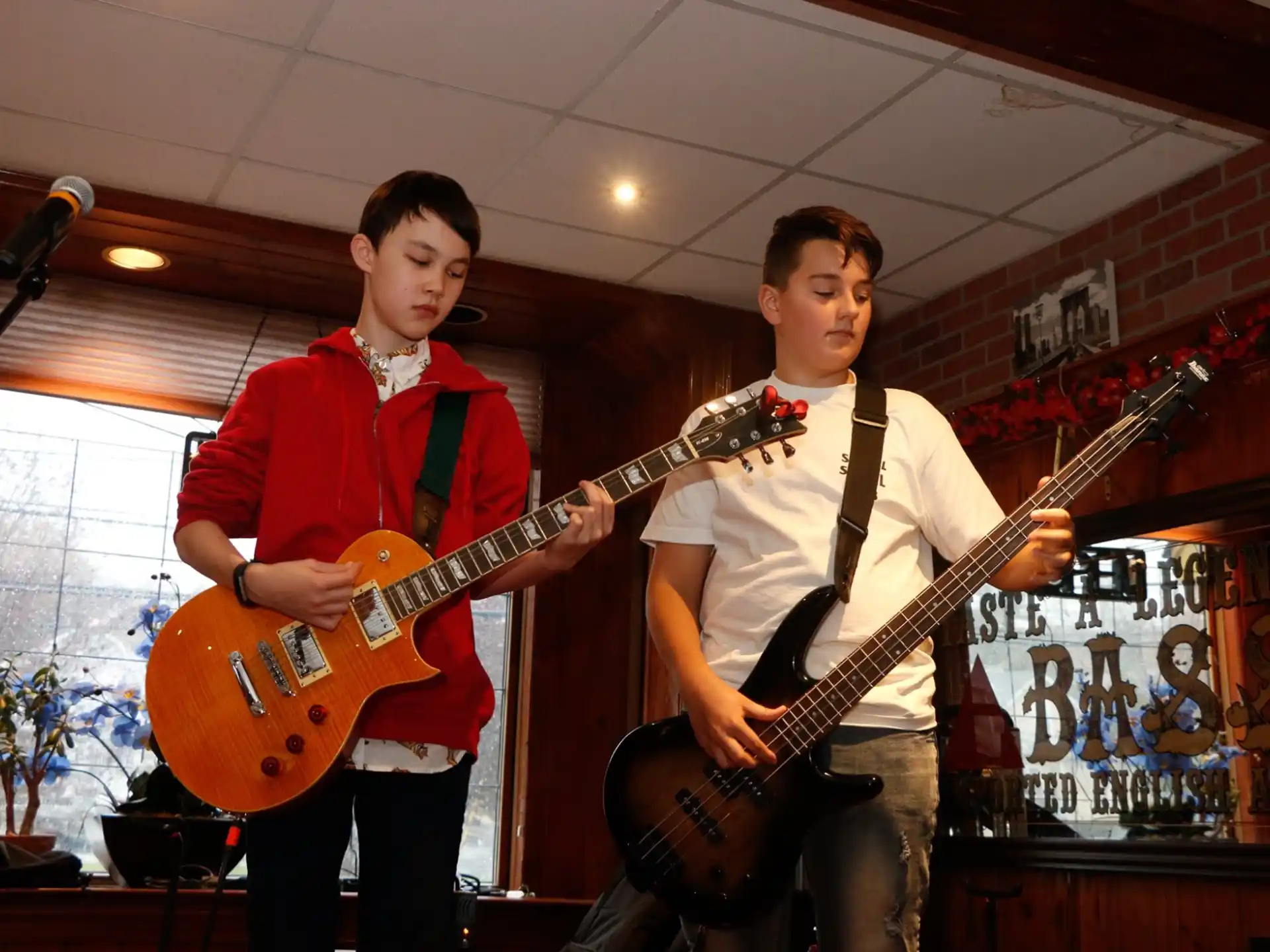 two men holding guitars