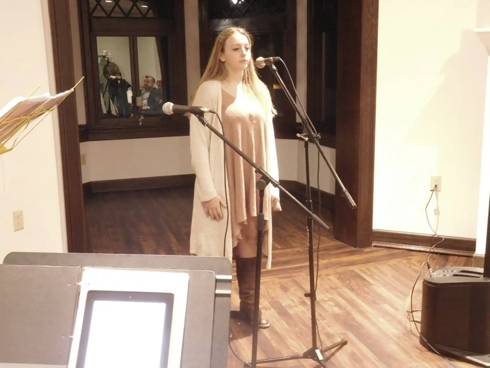 a person singing into a microphone