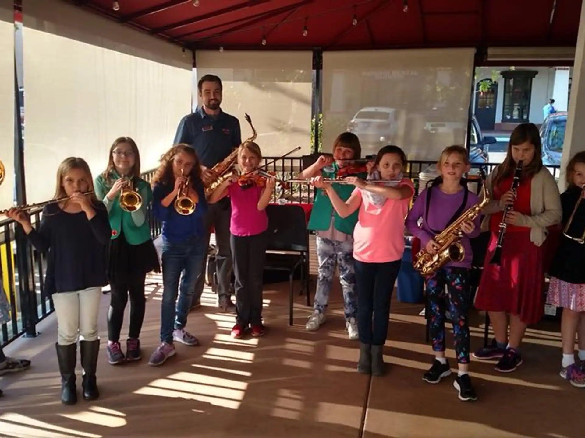 a group of people holding instruments
