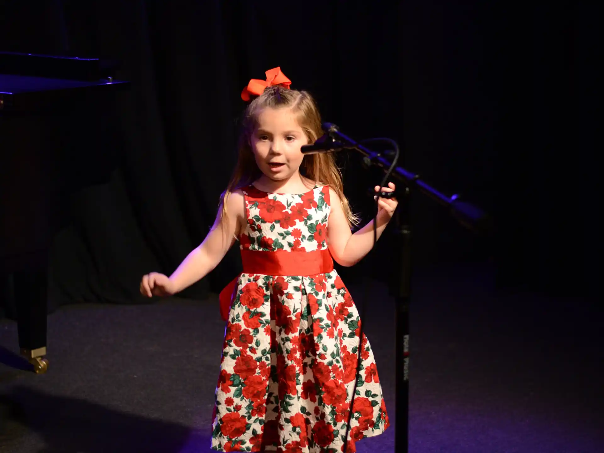 a girl holding a microphone