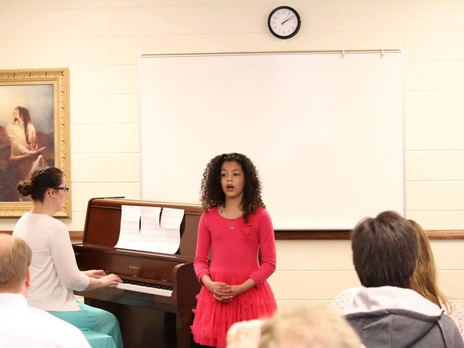 a person standing in front of a group of people
