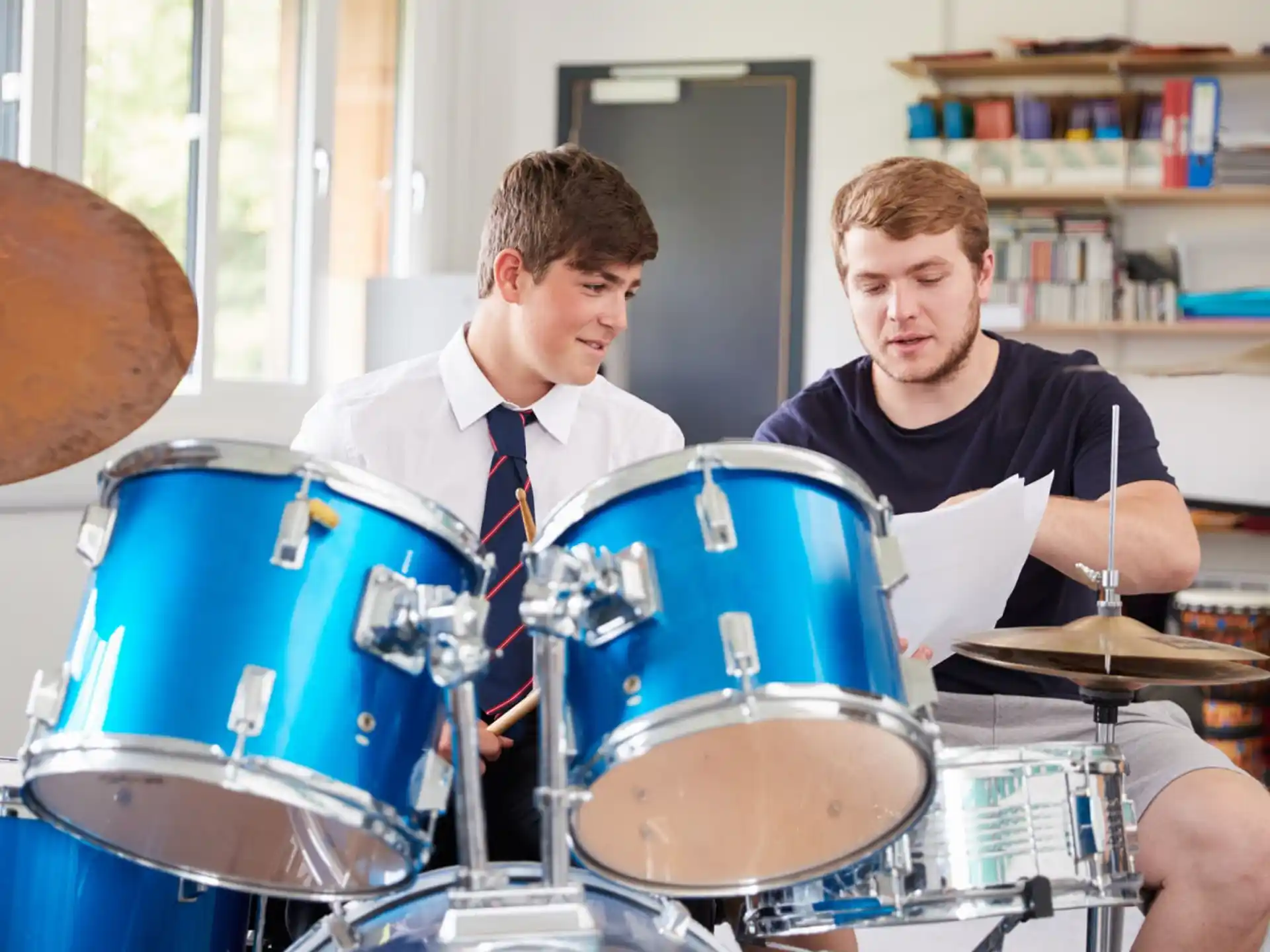 a couple of men playing drums