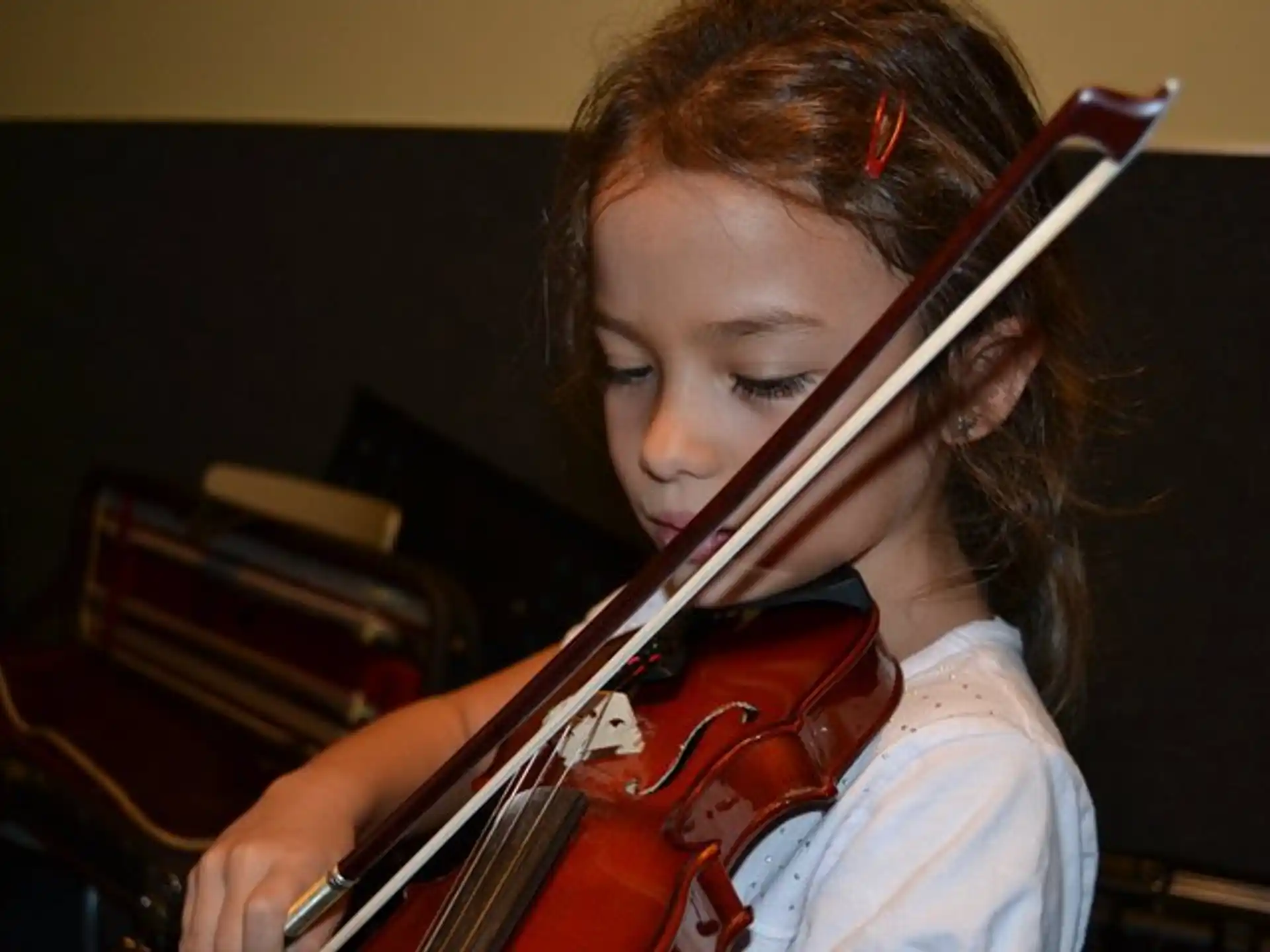 a girl playing a violin