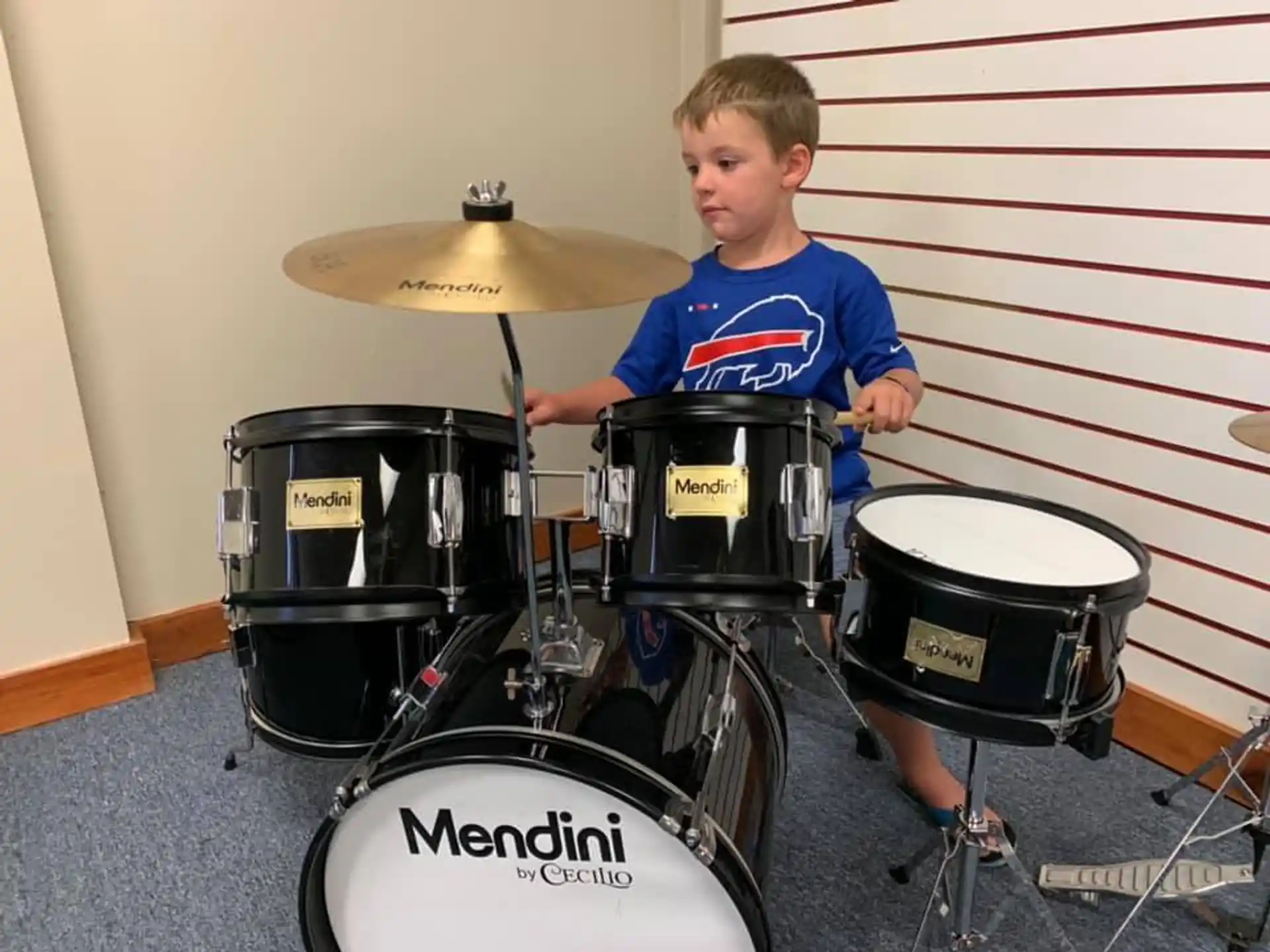 a boy playing drums