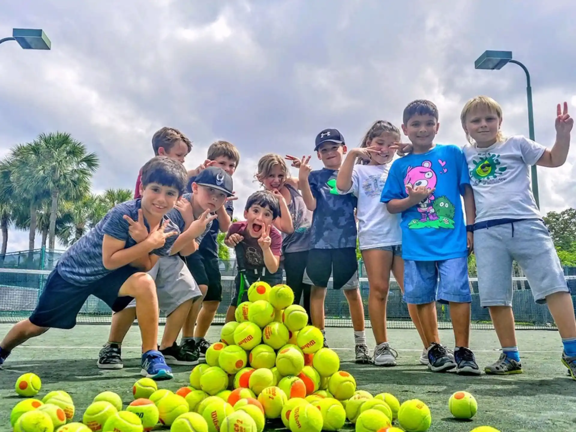a group of people posing for a photo next to a large ball