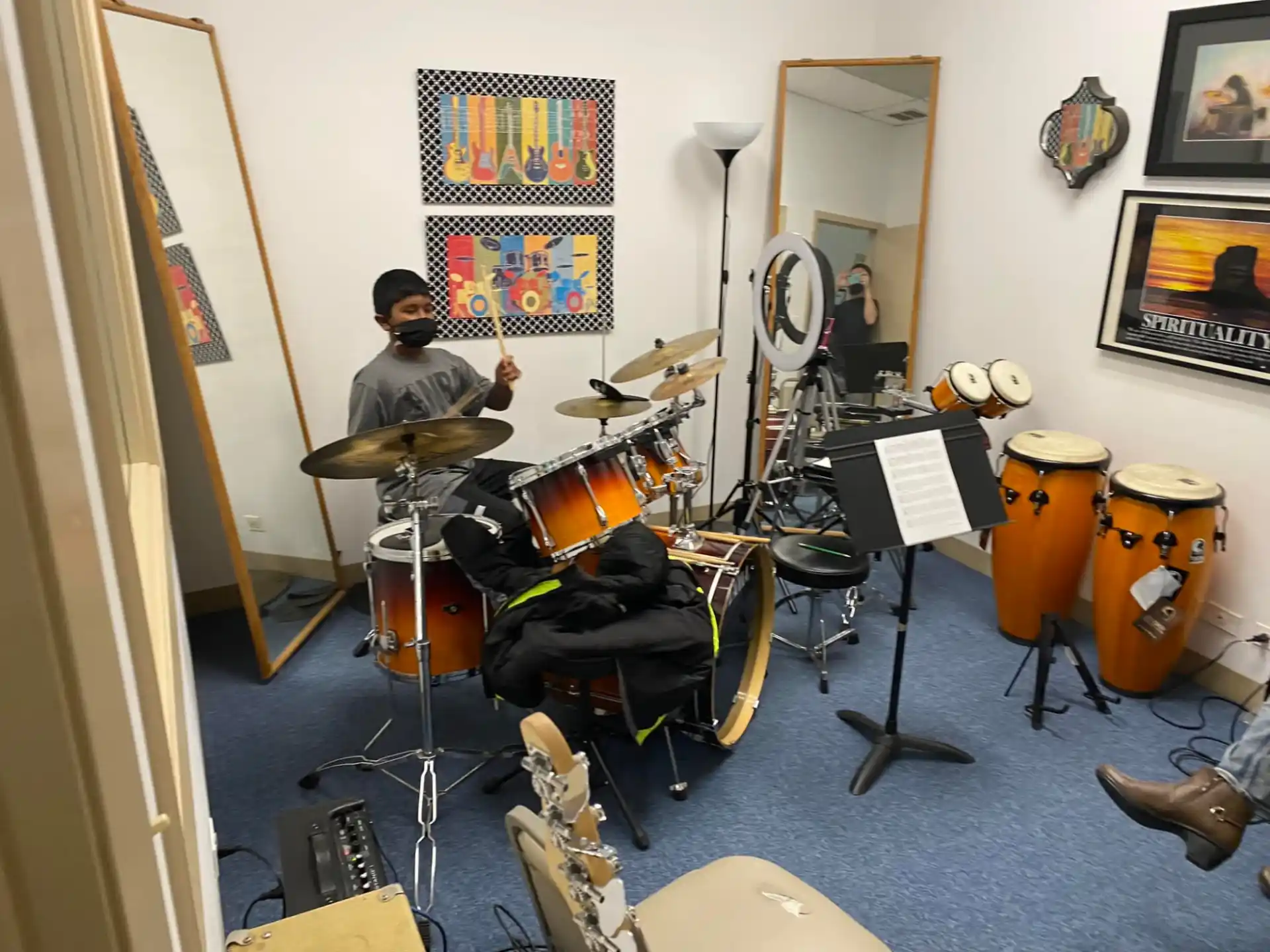 a person playing a drum set