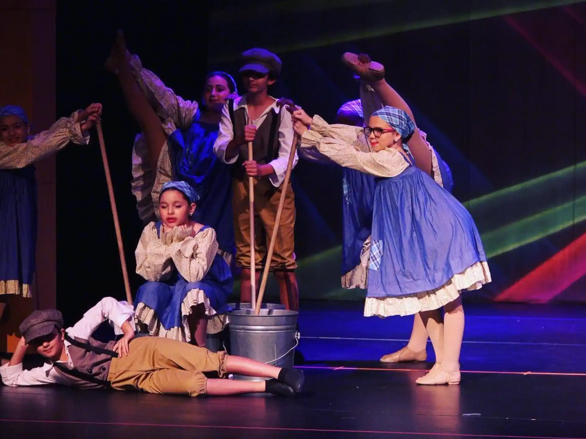 a group of people performing on stage