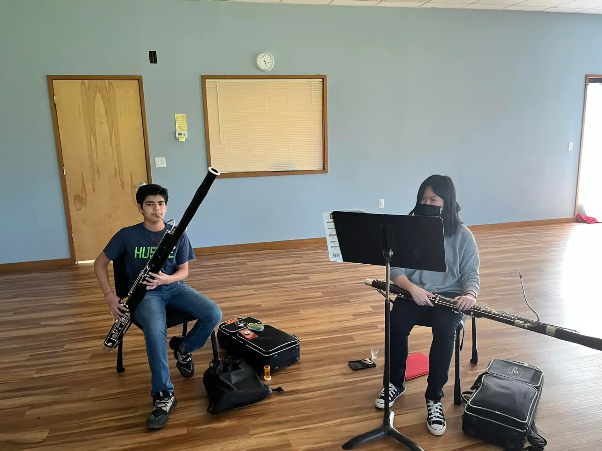 a couple of people playing guitars