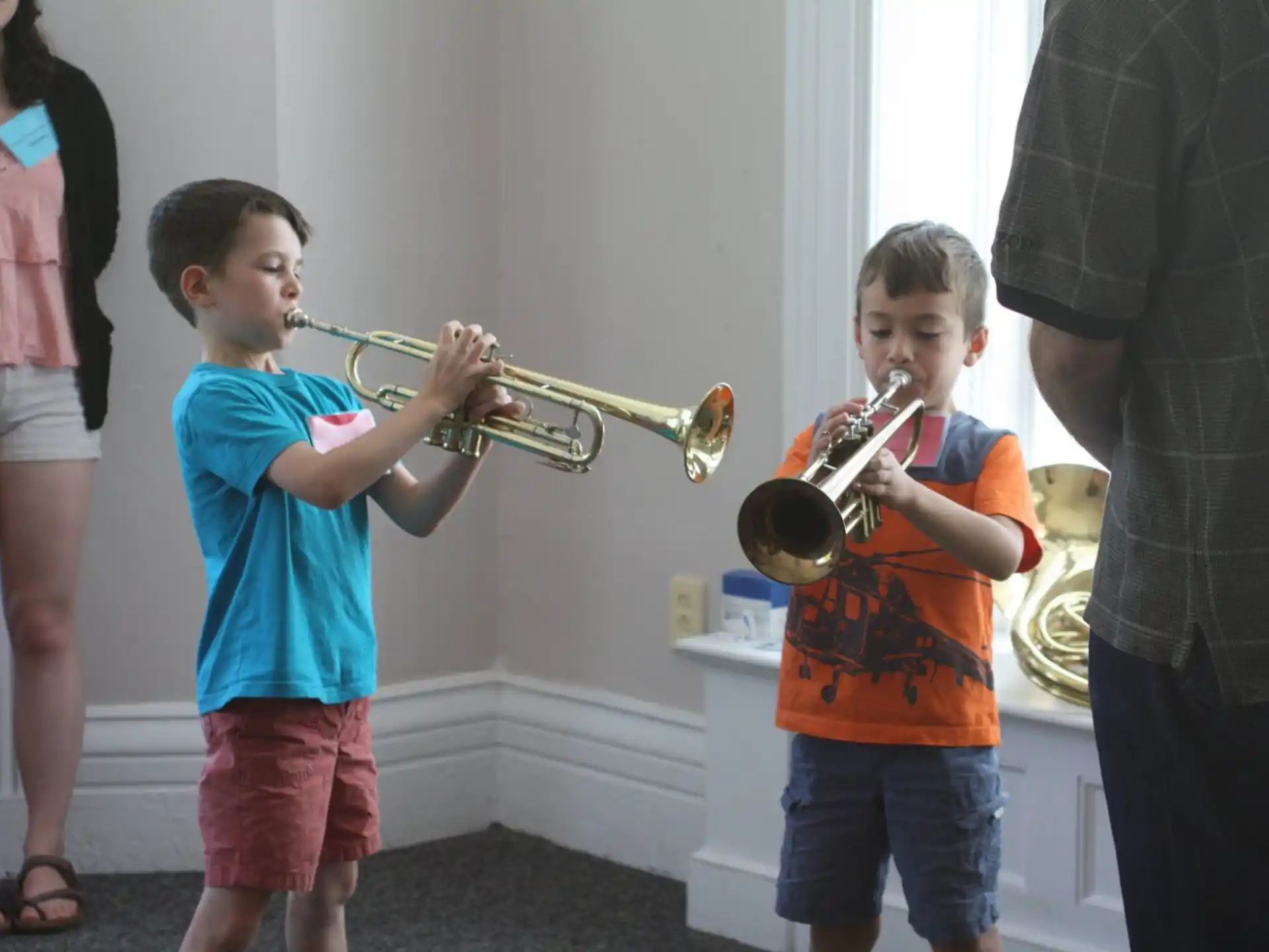 a boy playing a trumpet