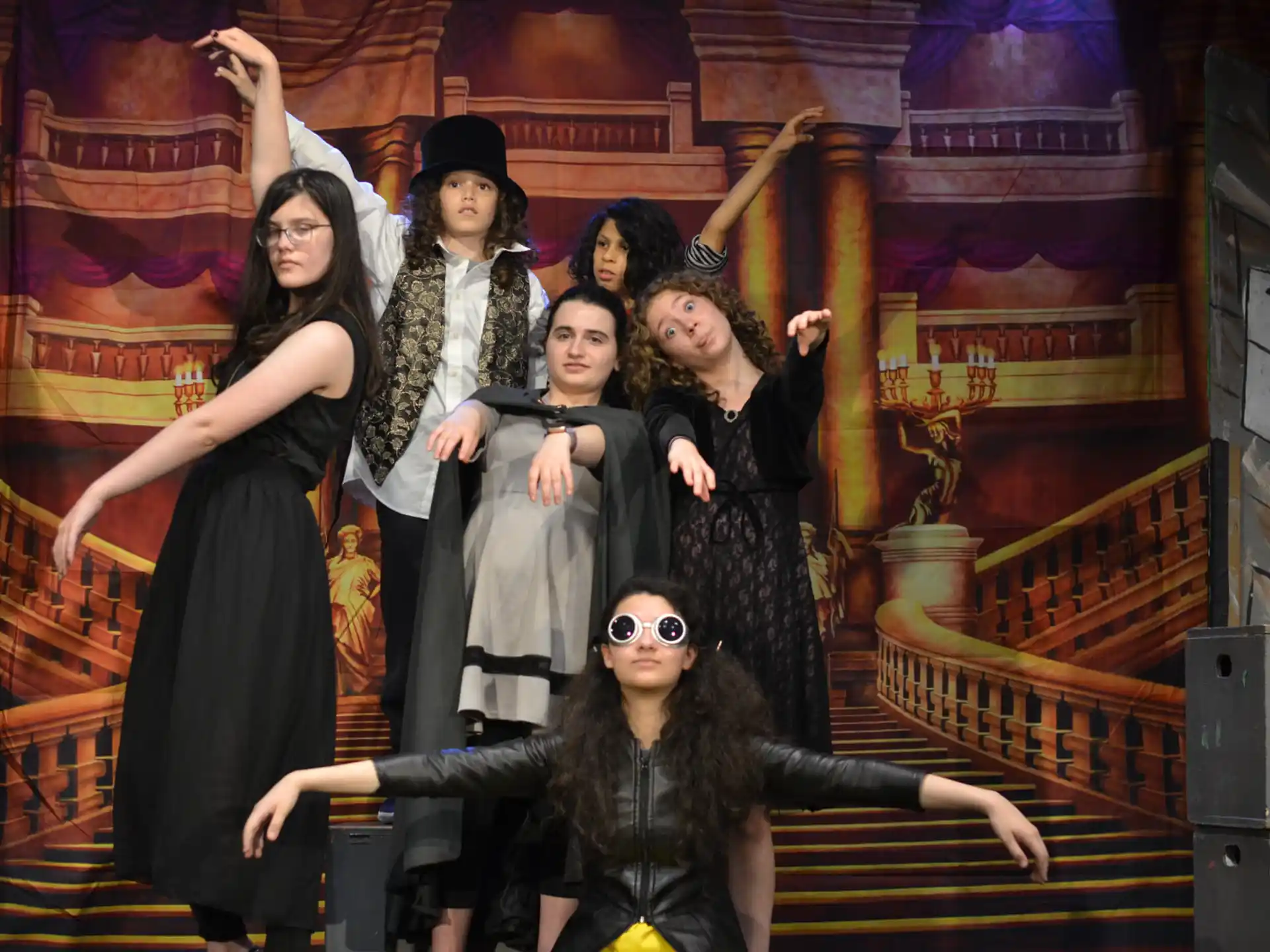 a group of people posing for a photo on a staircase