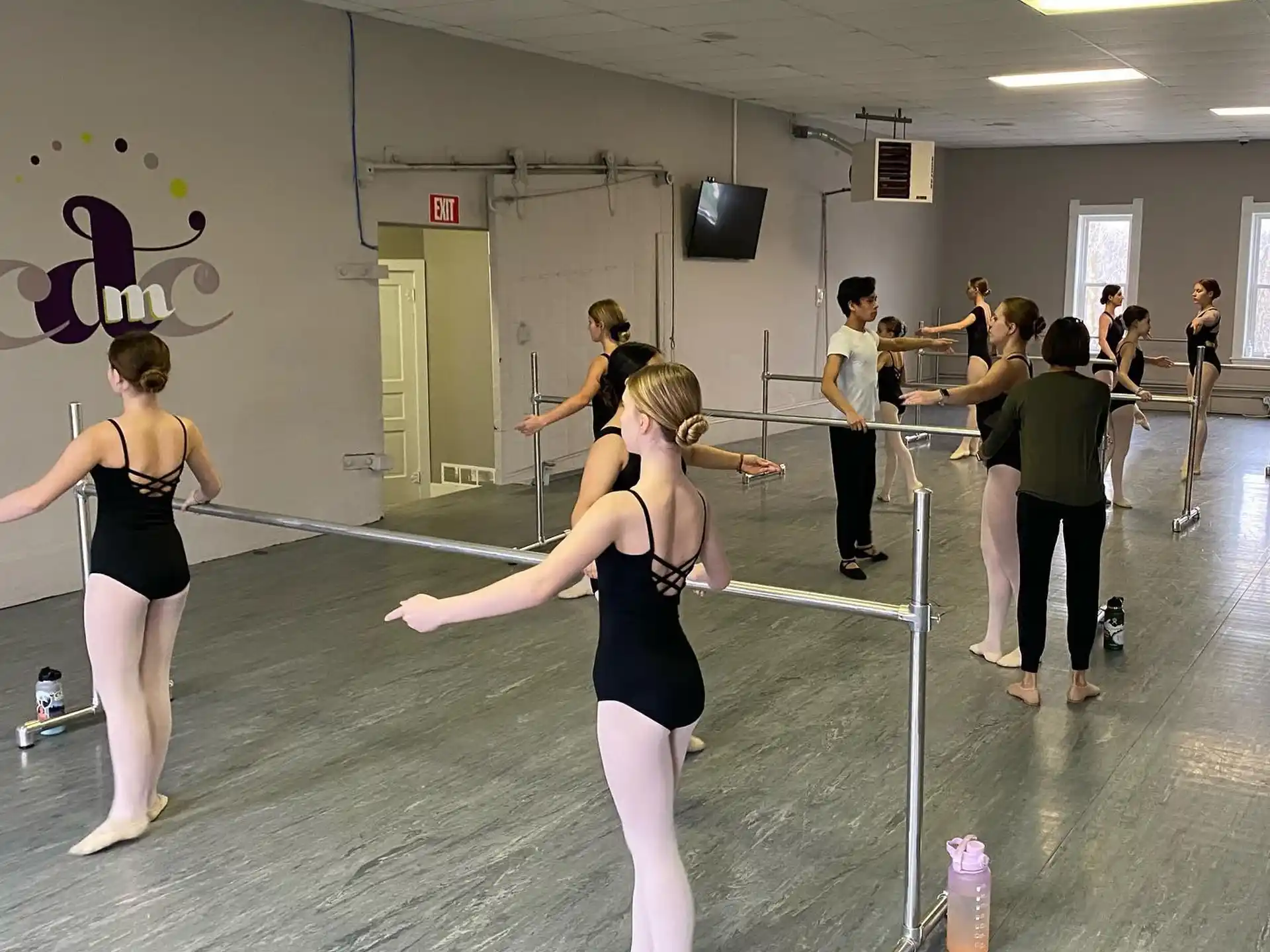 a group of people exercising in a gym