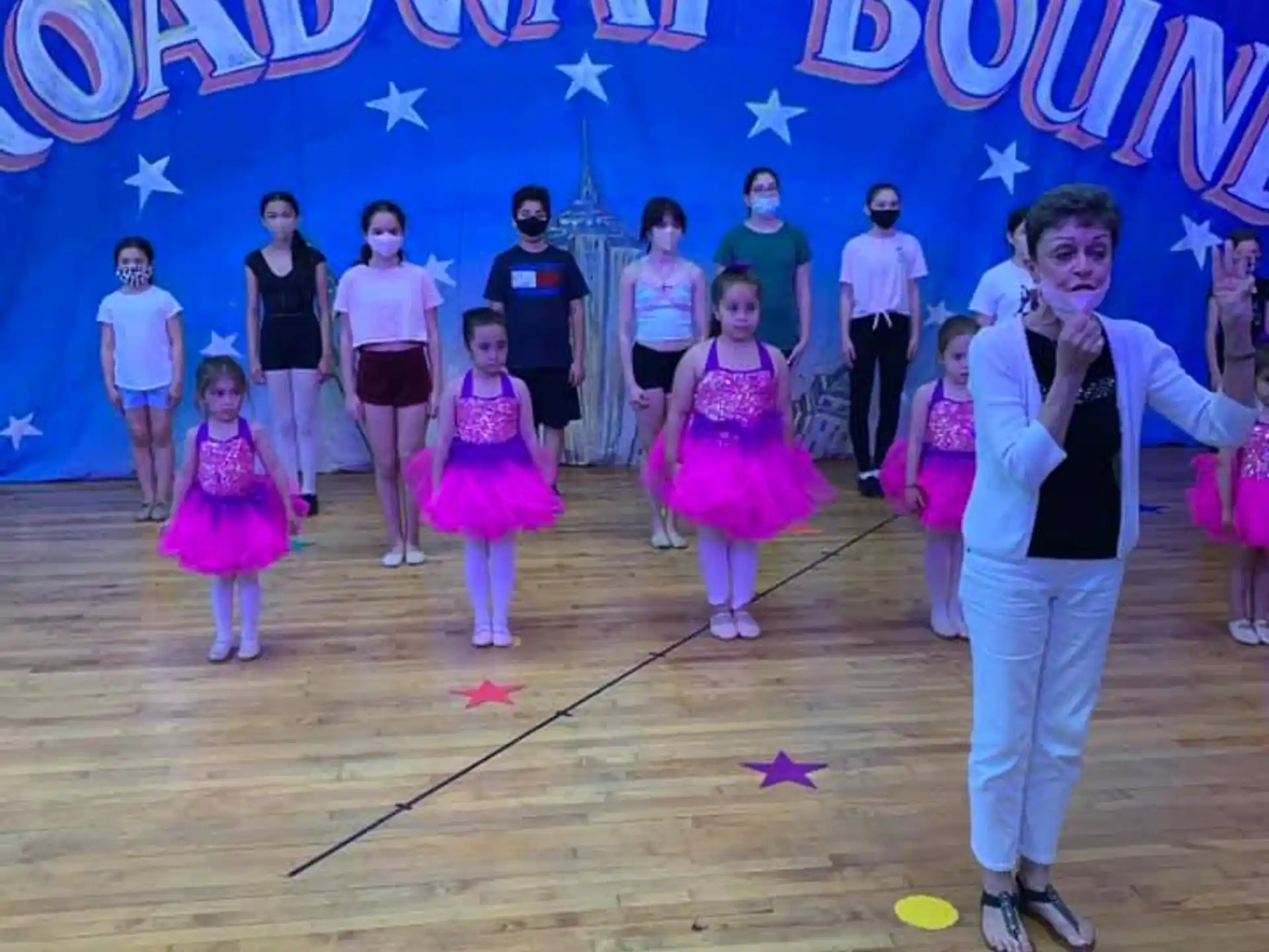a group of people dancing on a stage