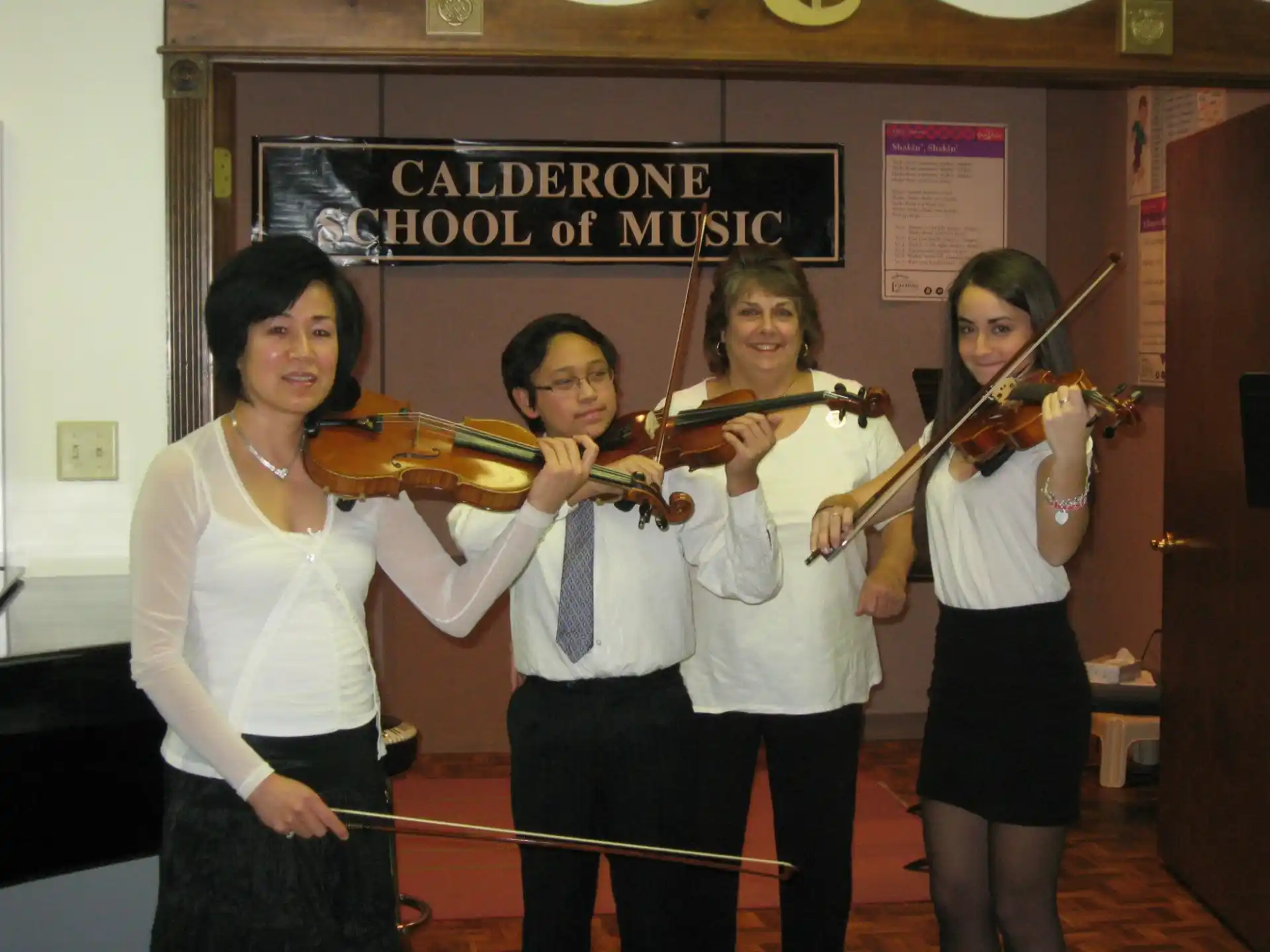 a group of people holding musical instruments