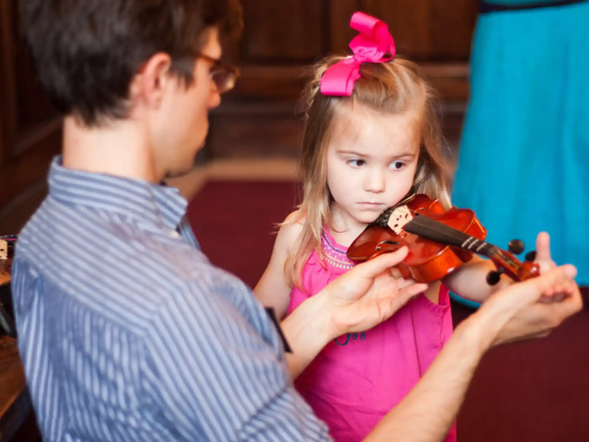 a girl playing a violin