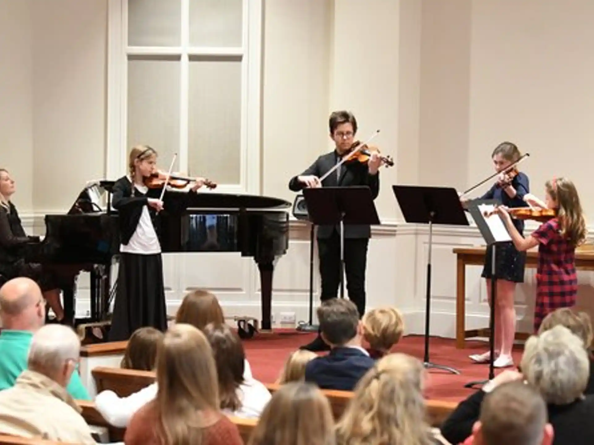 a group of people playing instruments
