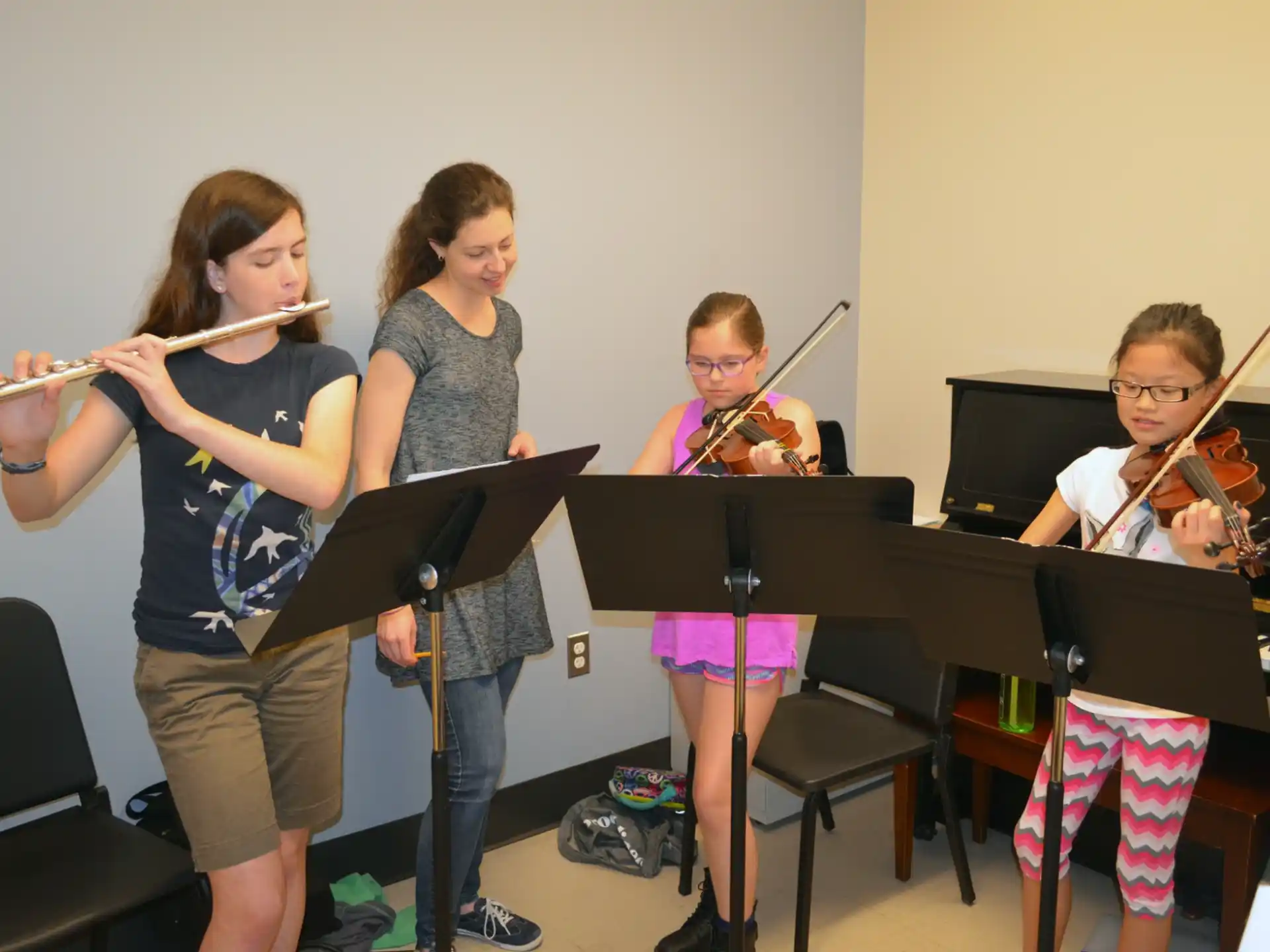 a group of kids playing musical instruments