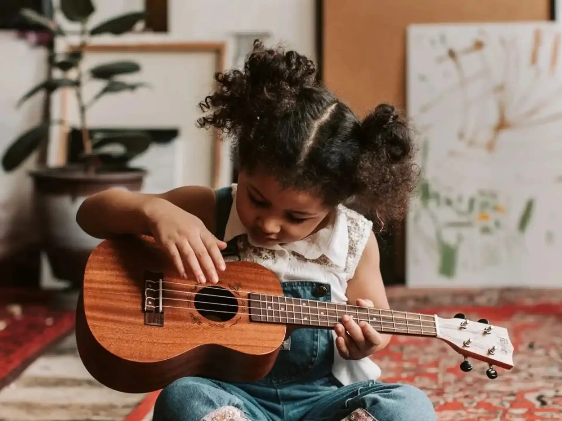 a child playing a guitar
