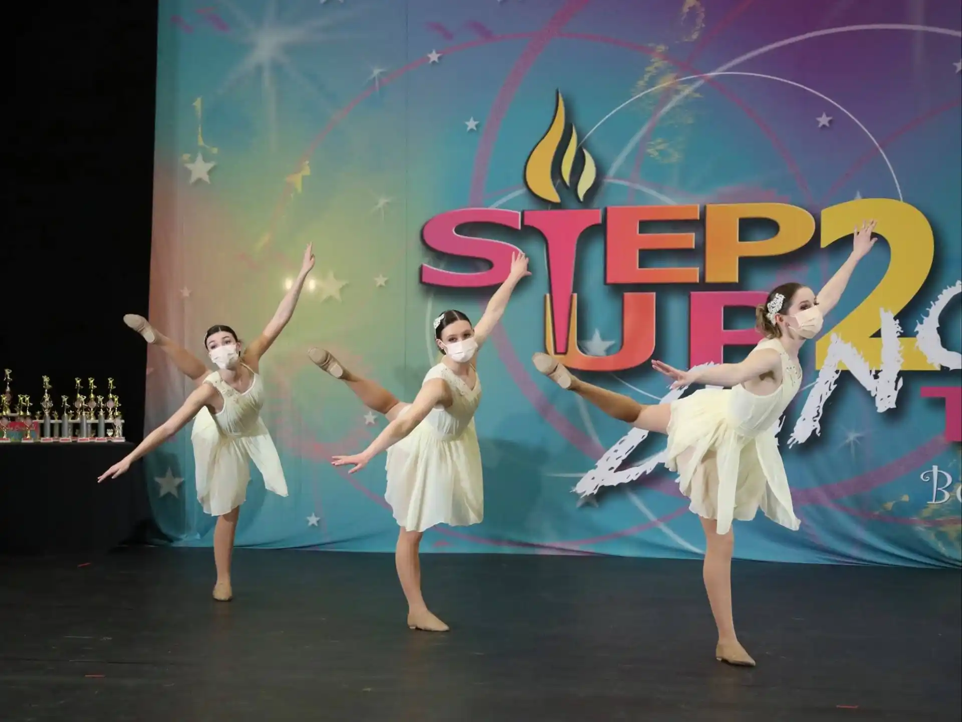 a group of women dancing on a stage