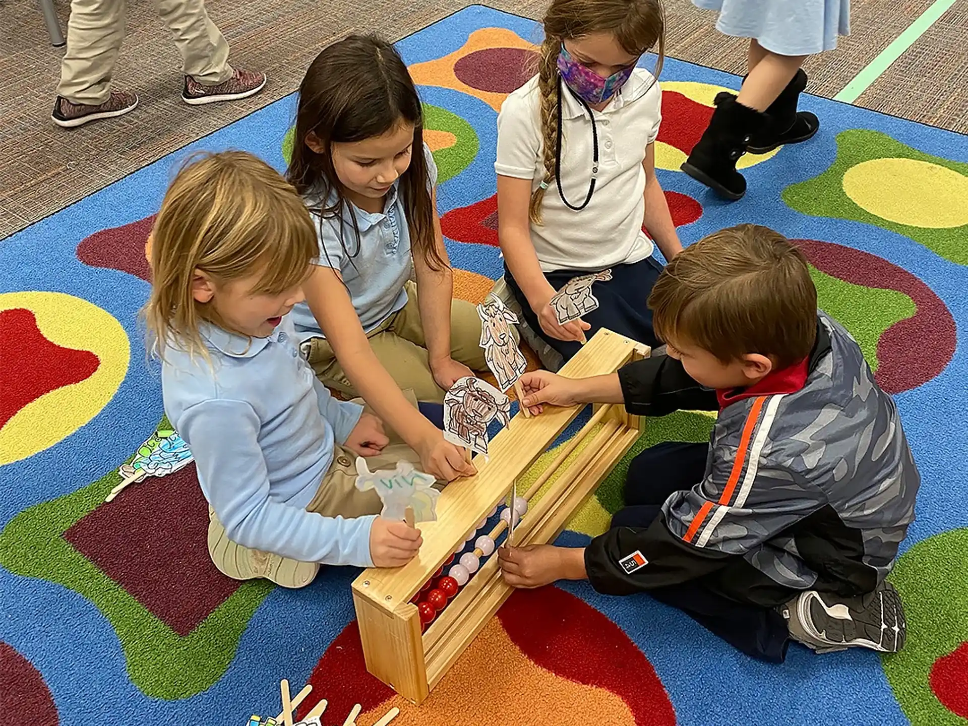 a group of children playing with a puzzle on the floor
