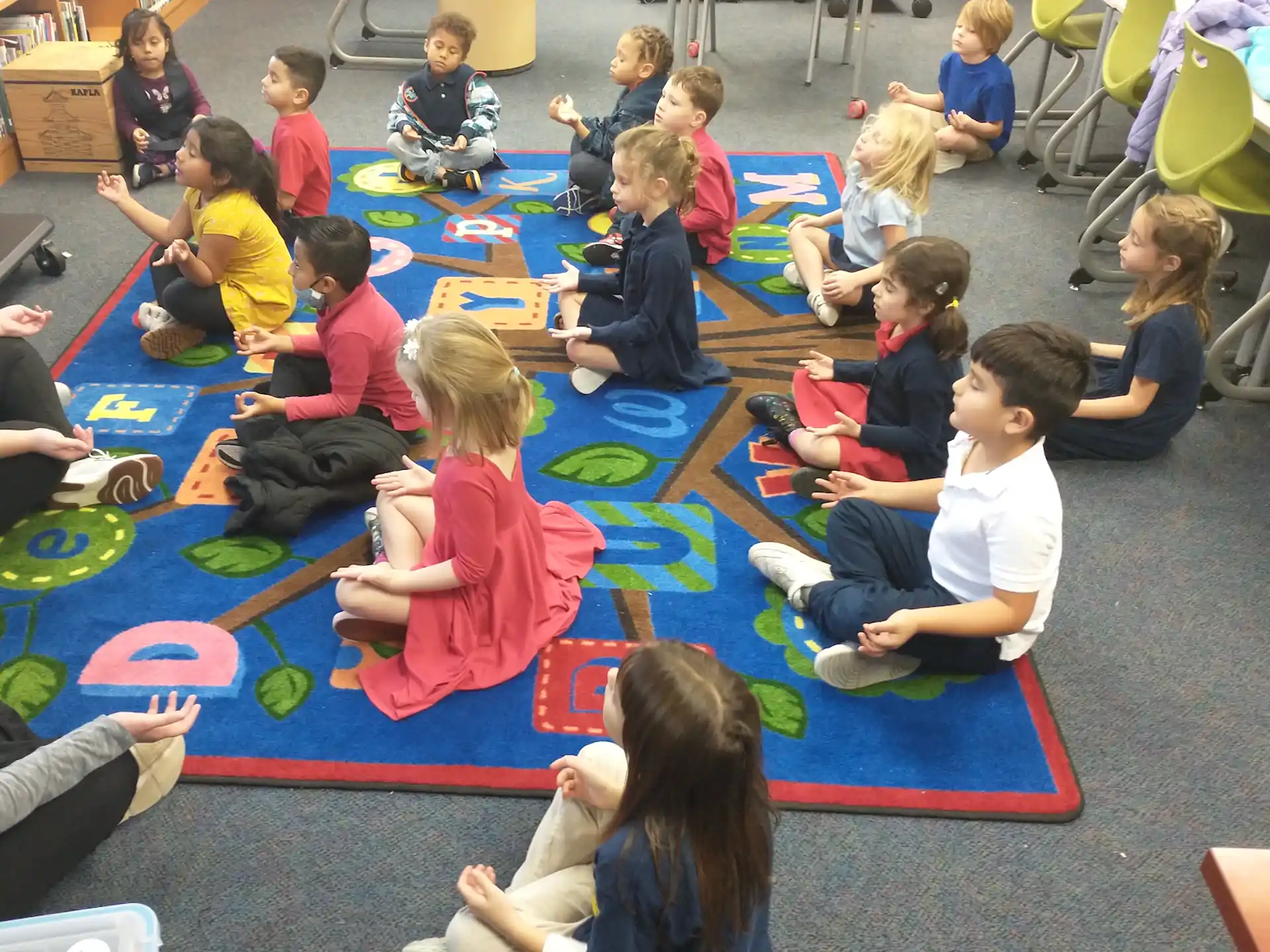 a group of children sitting on the floor
