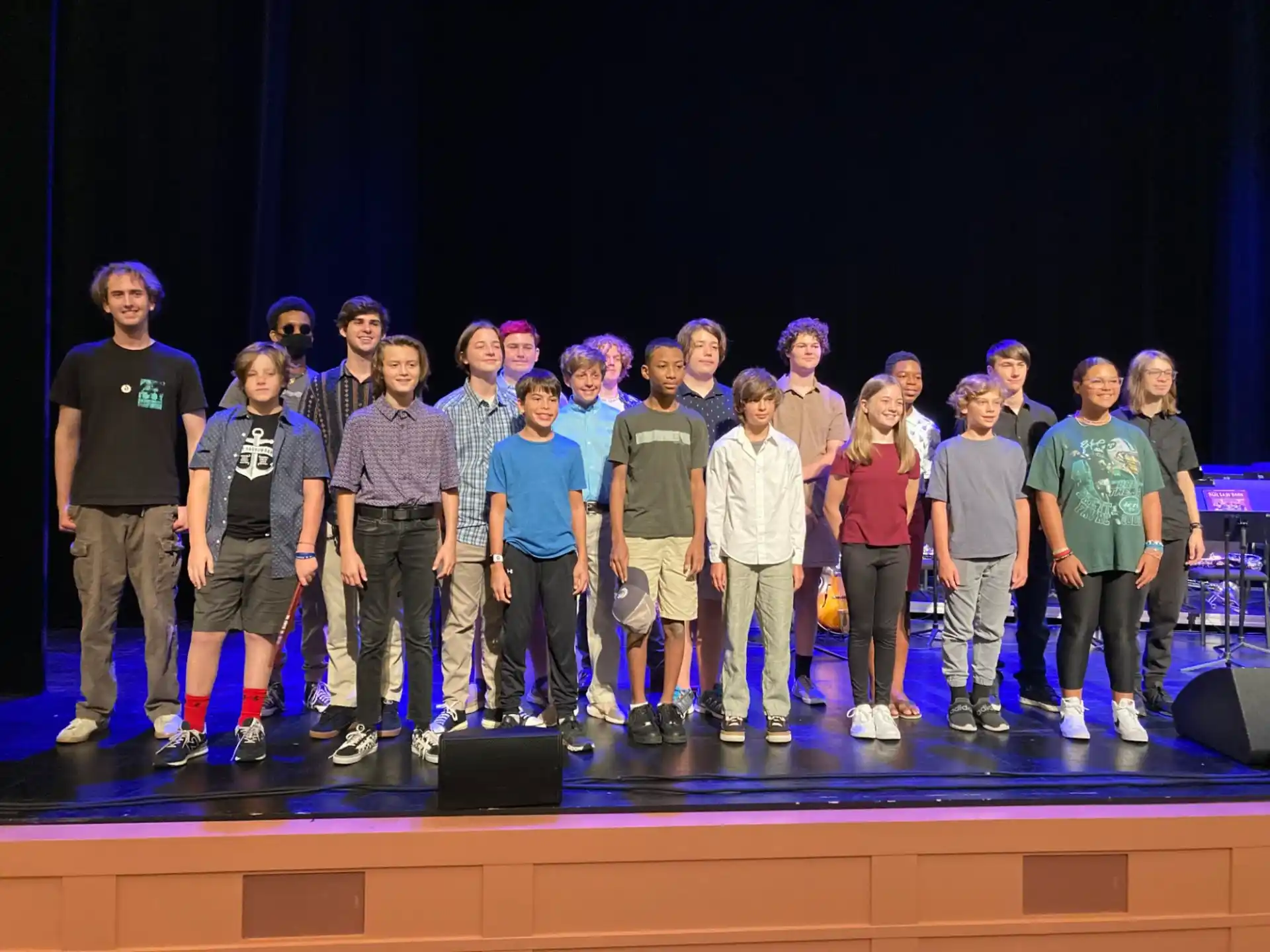 a group of people standing on a stage