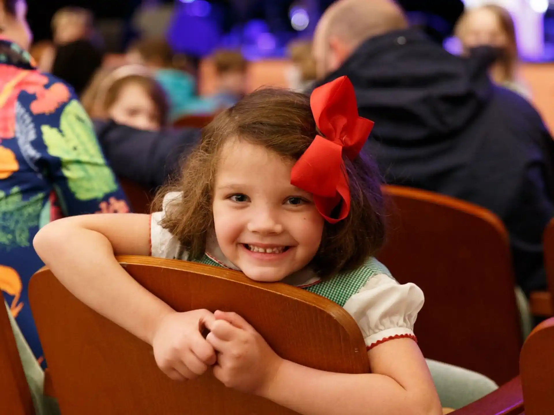 a girl sitting in a chair